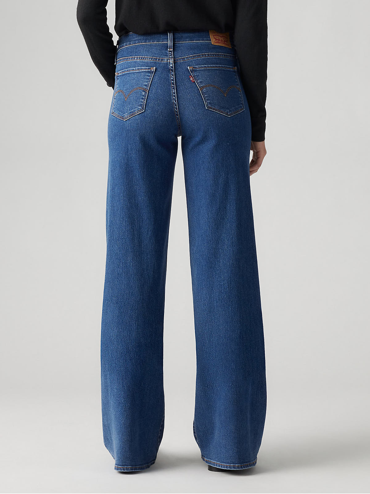 Back view of Levi’s 318 Clever Girl 20” Wide Jeans in classic blue denim by Levi Strauss & Co.