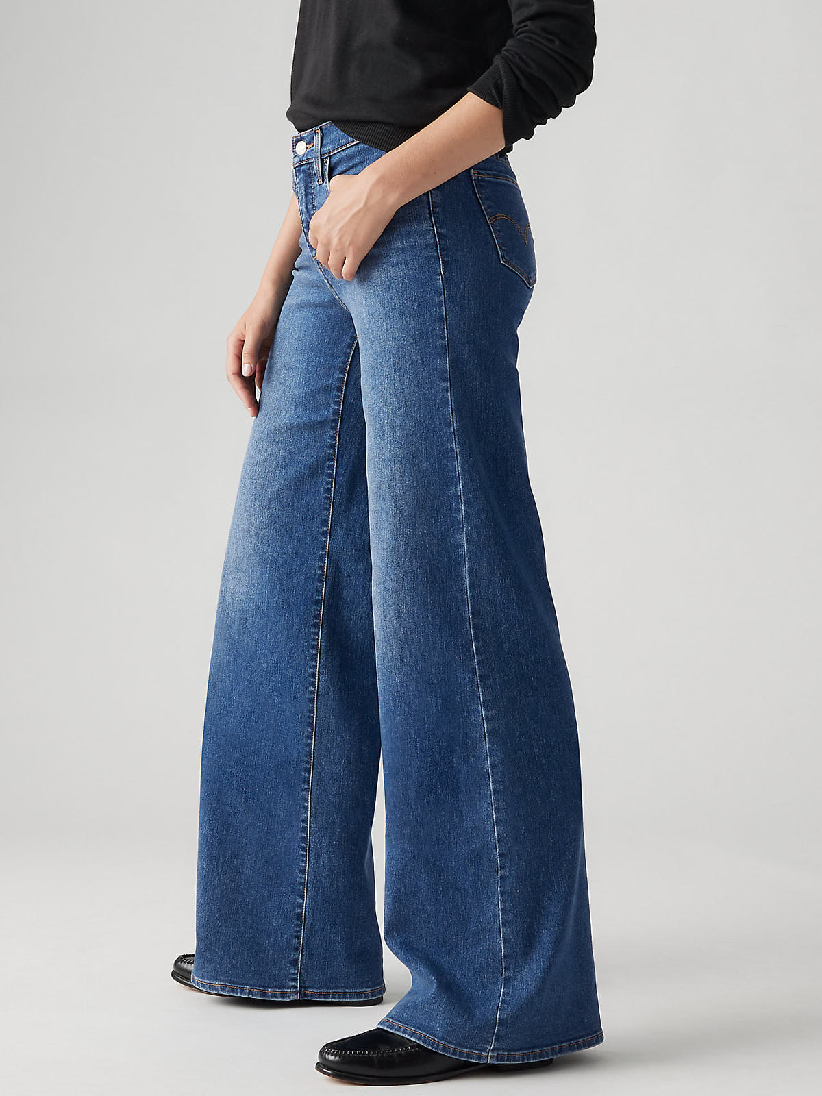 Levi’s 318 Clever Girl 20” Wide Jeans by Levi Strauss & Co in classic blue denim with a wide-leg fit and high waist.