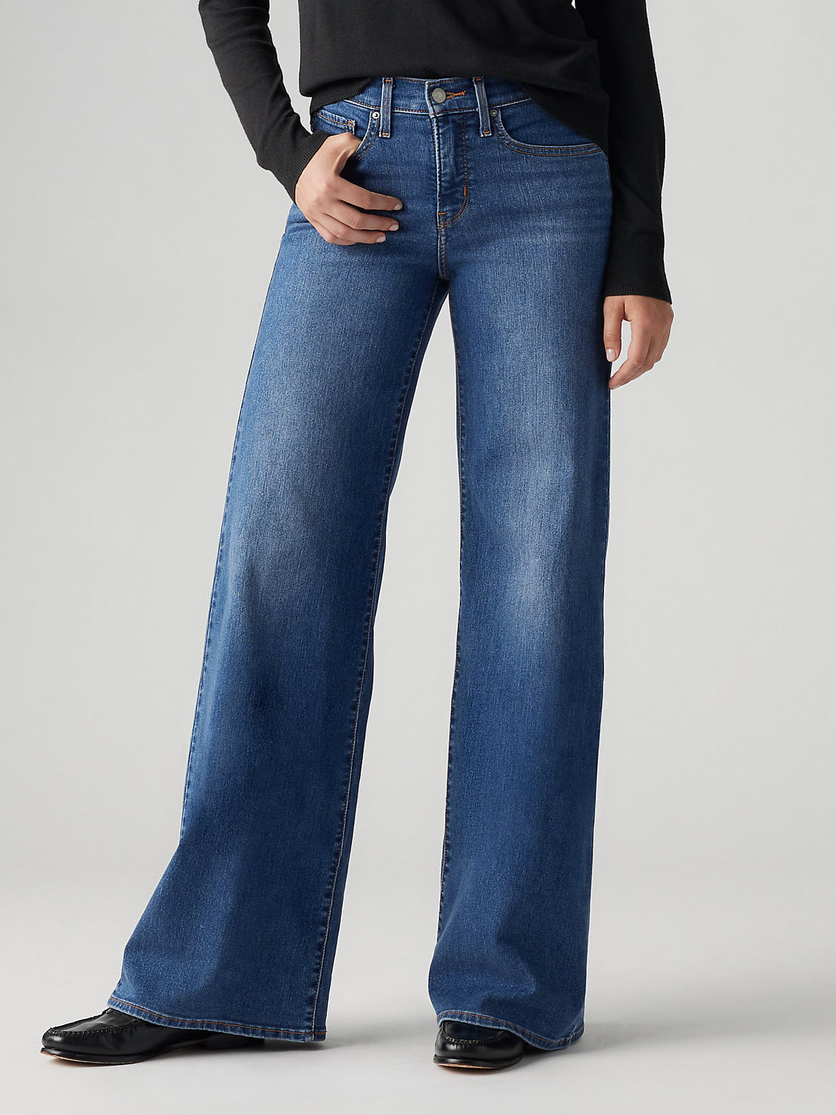 Levi’s 318 Clever Girl 20” Wide Jeans in blue denim by Levi Strauss & Co with a wide leg fit and classic styling