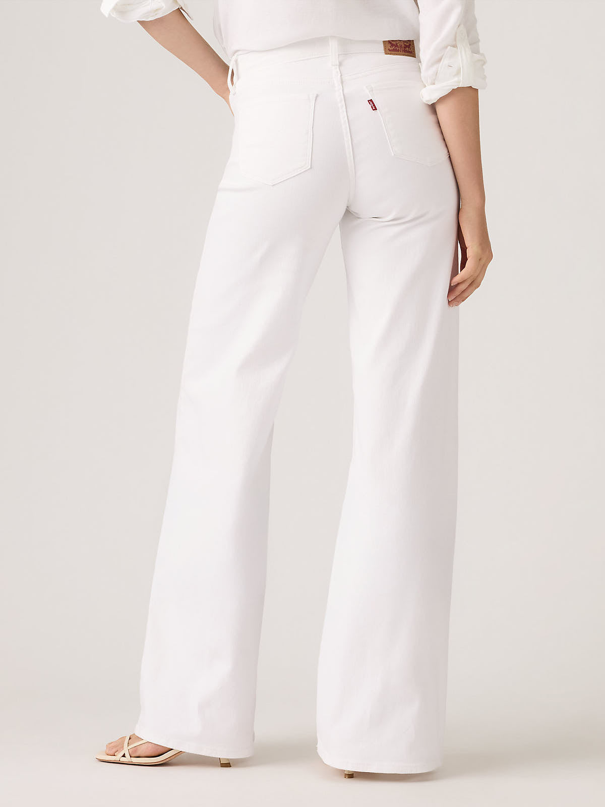 Levi’s 318 Shaping Clean White Wide Jeans by Levi Strauss & Co in white denim with a wide leg fit and back pockets.