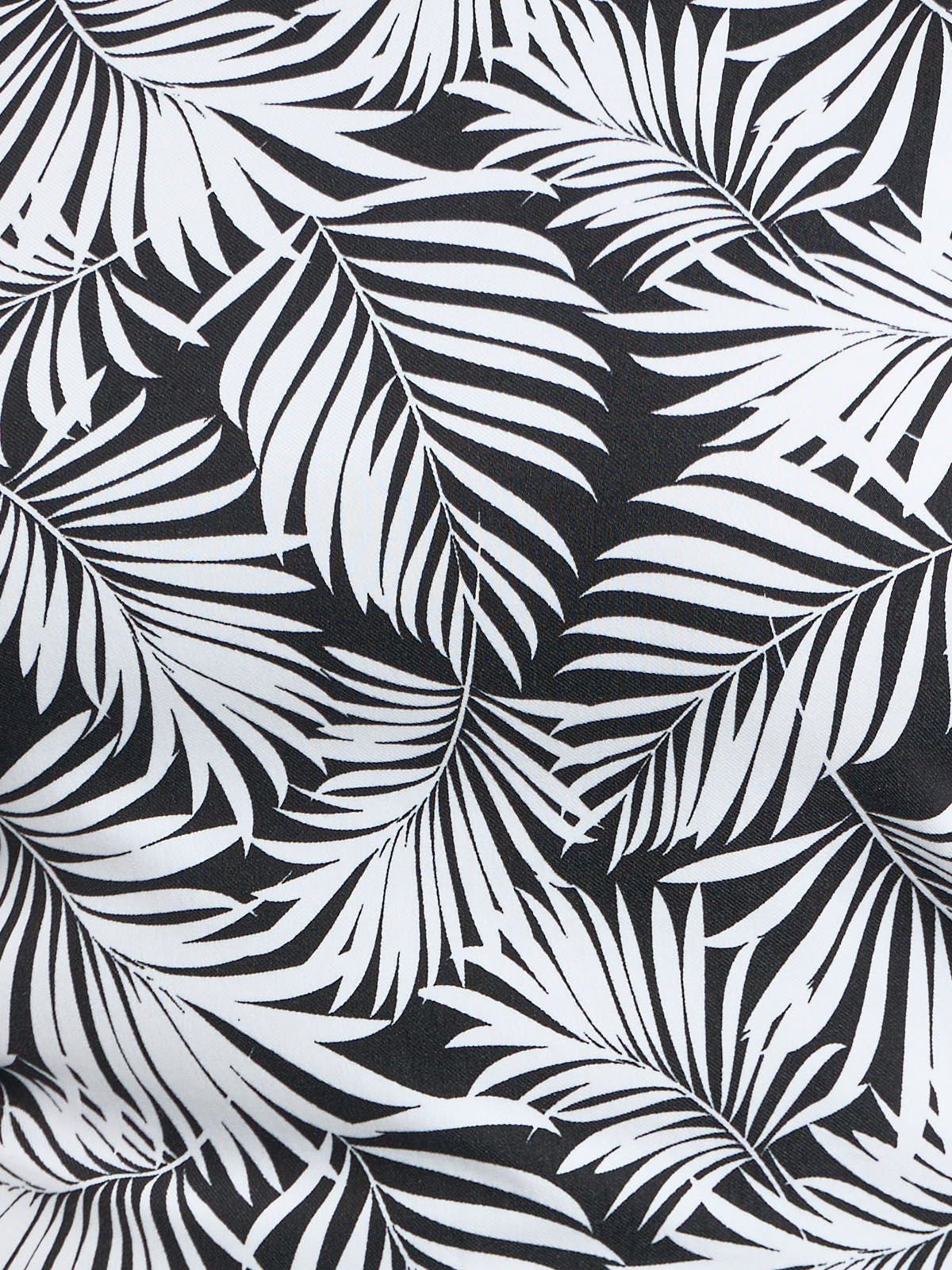 Close-up of black and white palm print fabric on the Lois Denim Camilla Palm Print Stretch Sleeveless Dress