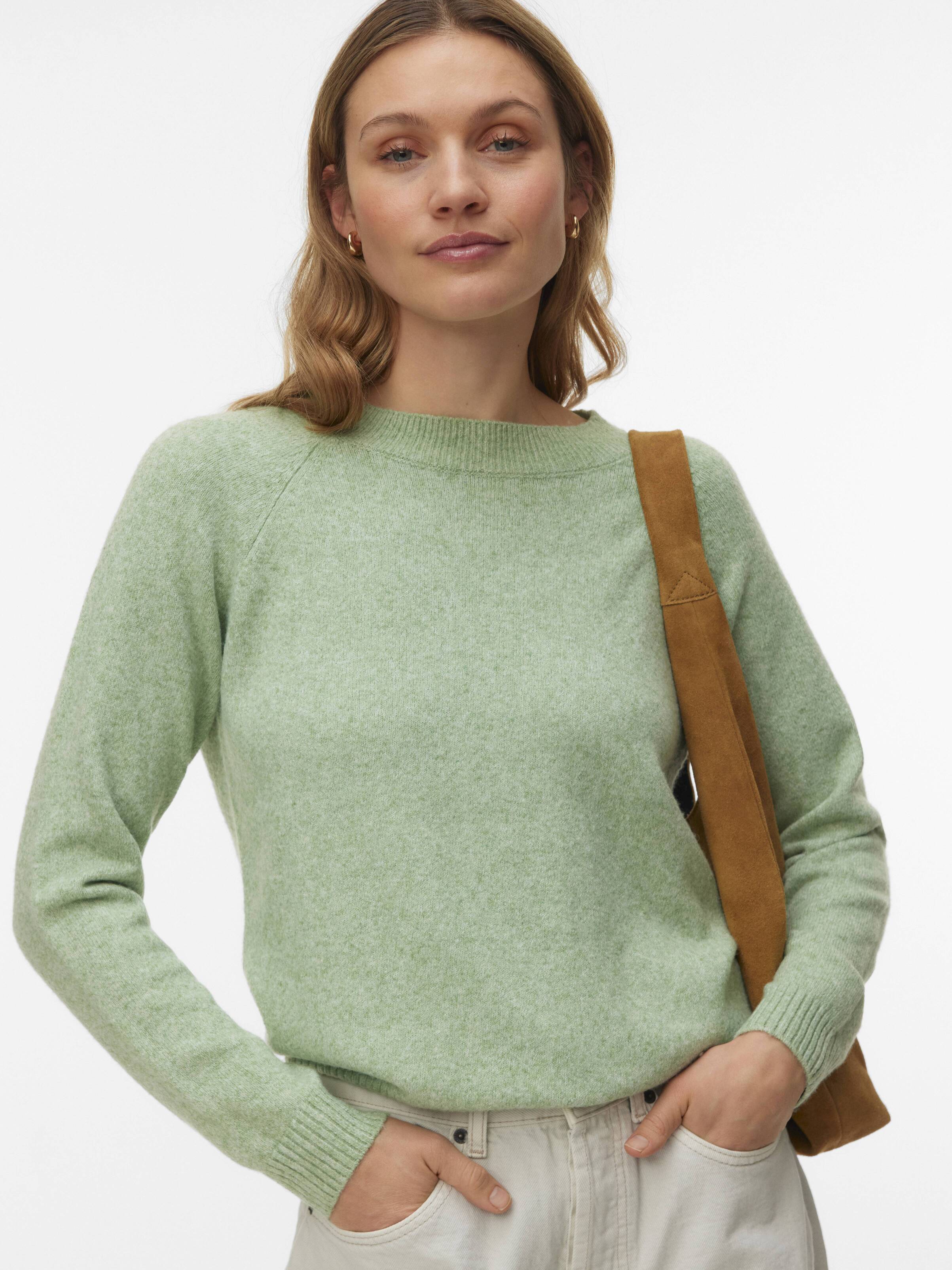 Vero Moda Softy Crew Neck Lightweight Sweater in soft green, styled with light pants and a brown shoulder bag