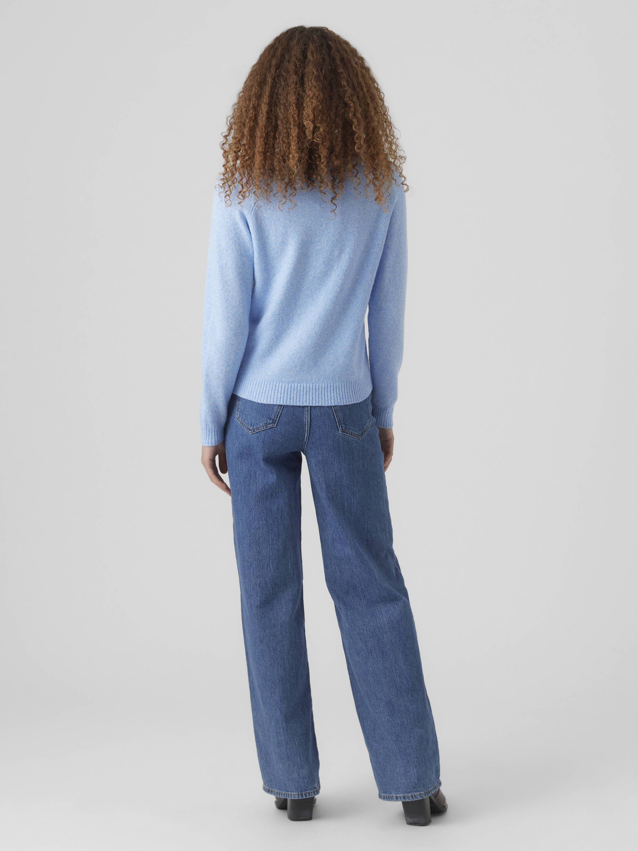 Back view of Vero Moda Softy Crew Neck Knit Sweater in soft blue paired with classic denim jeans and black shoes