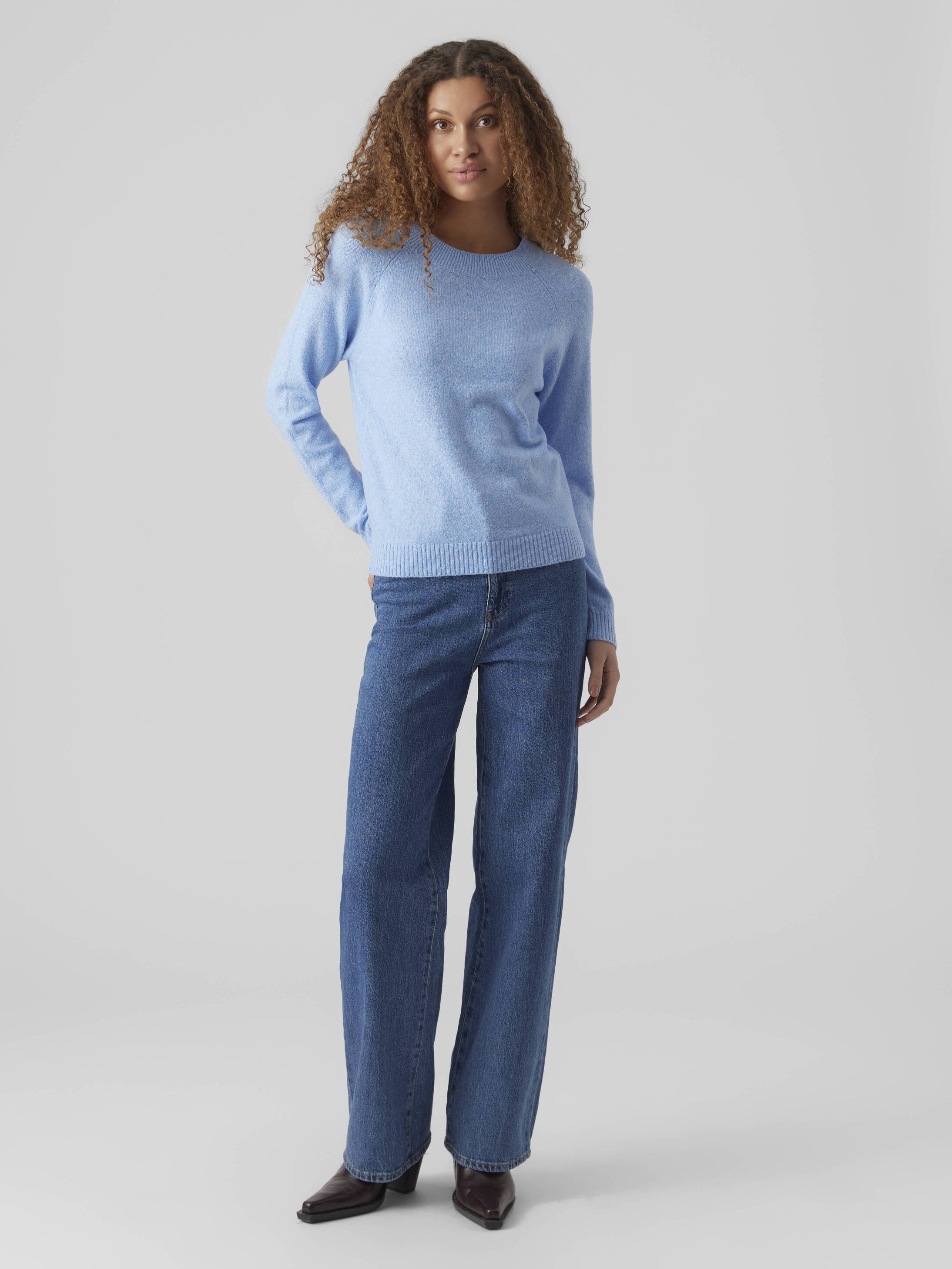 Light blue Vero Moda Softy Crew Neck Knit Sweater paired with blue jeans and dark shoes on a neutral background