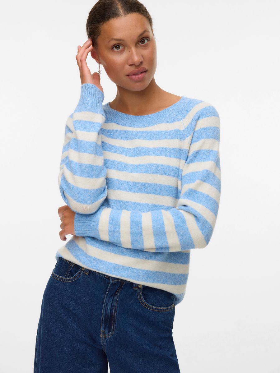 Model in a blue and white striped Vero Moda Doffy Crew Neck Knit Sweater paired with dark denim jeans
