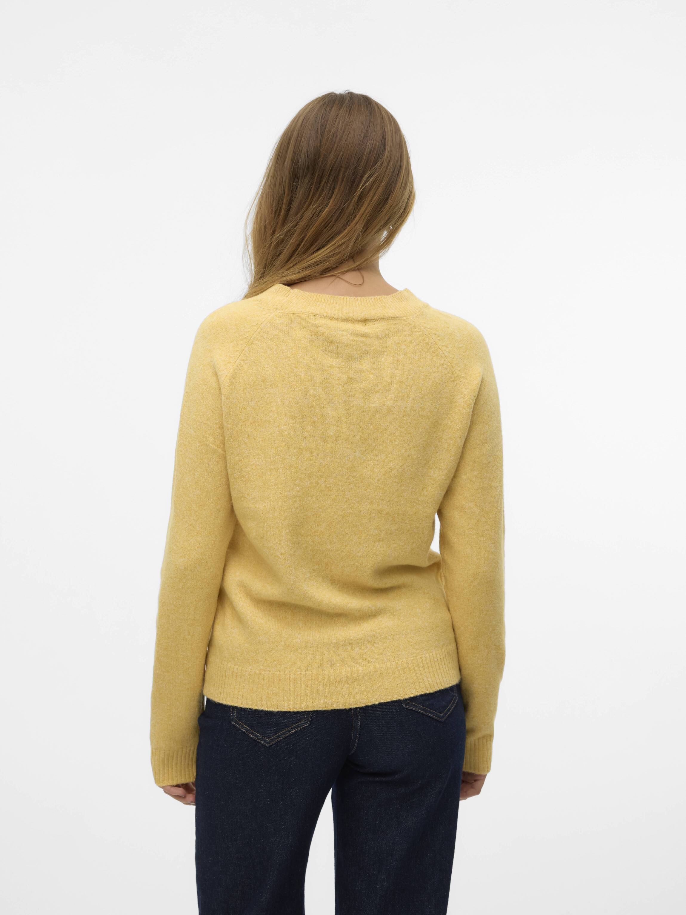 Back view of Vero Moda Softy Crew Neck Knit Sweater in soft yellow paired with dark denim jeans by Vero Moda.