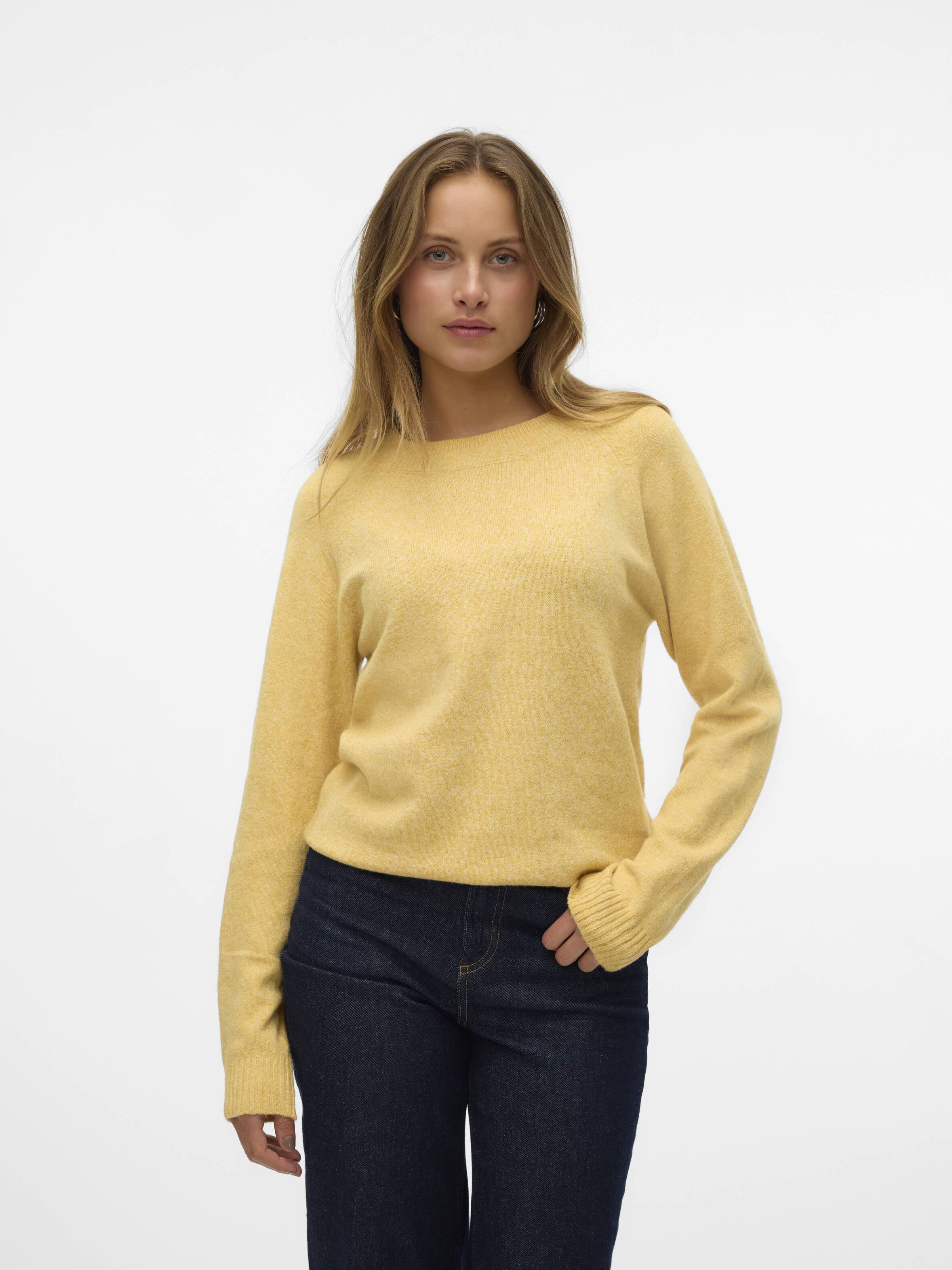 Vero Moda Softy Crew Neck Knit Sweater in soft yellow knit paired with dark denim jeans, styled simply and elegantly.