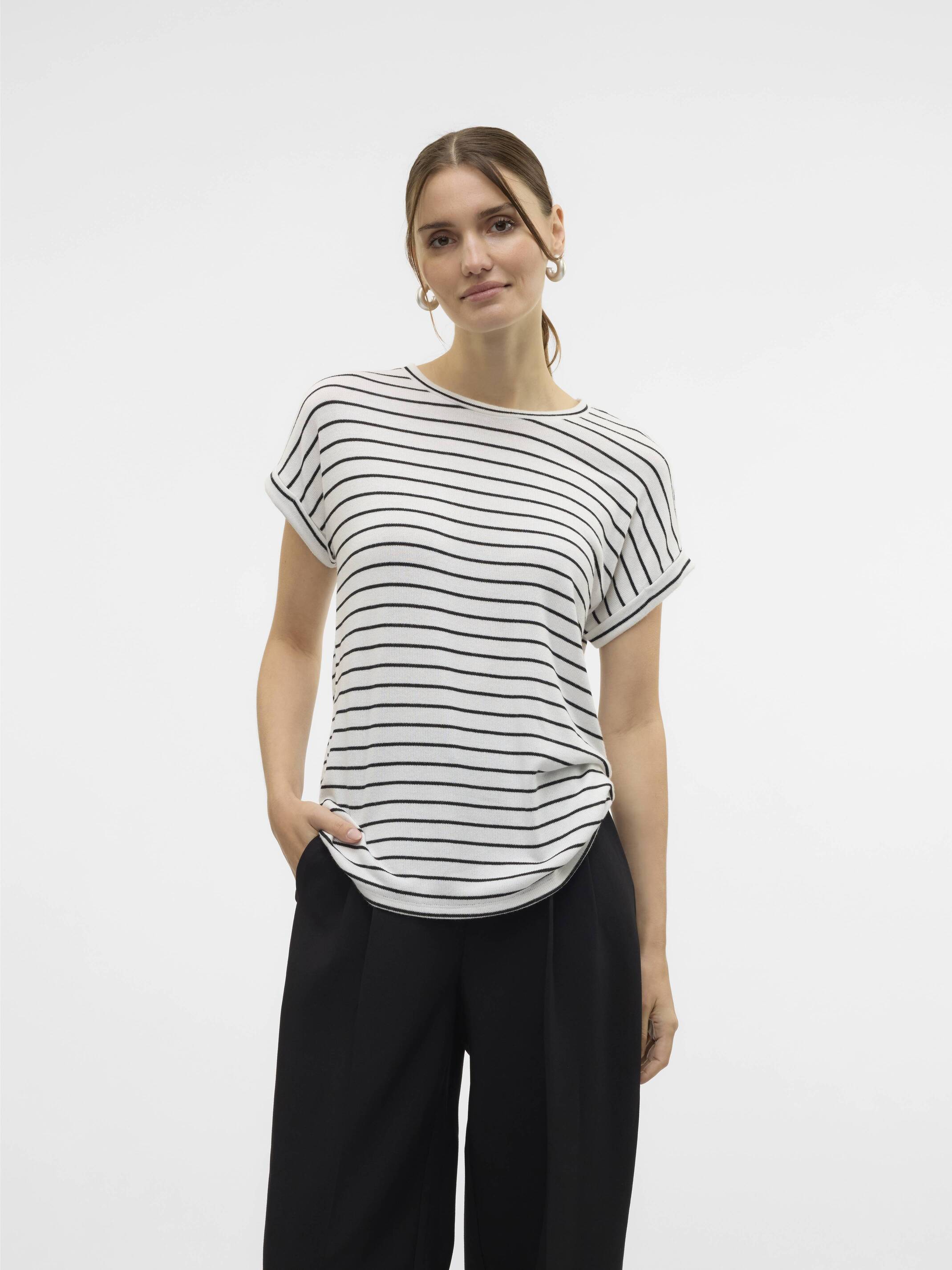 Casual white and black striped Vero Moda Bria Short Sleeve Crew Neck Top styled with black pants.