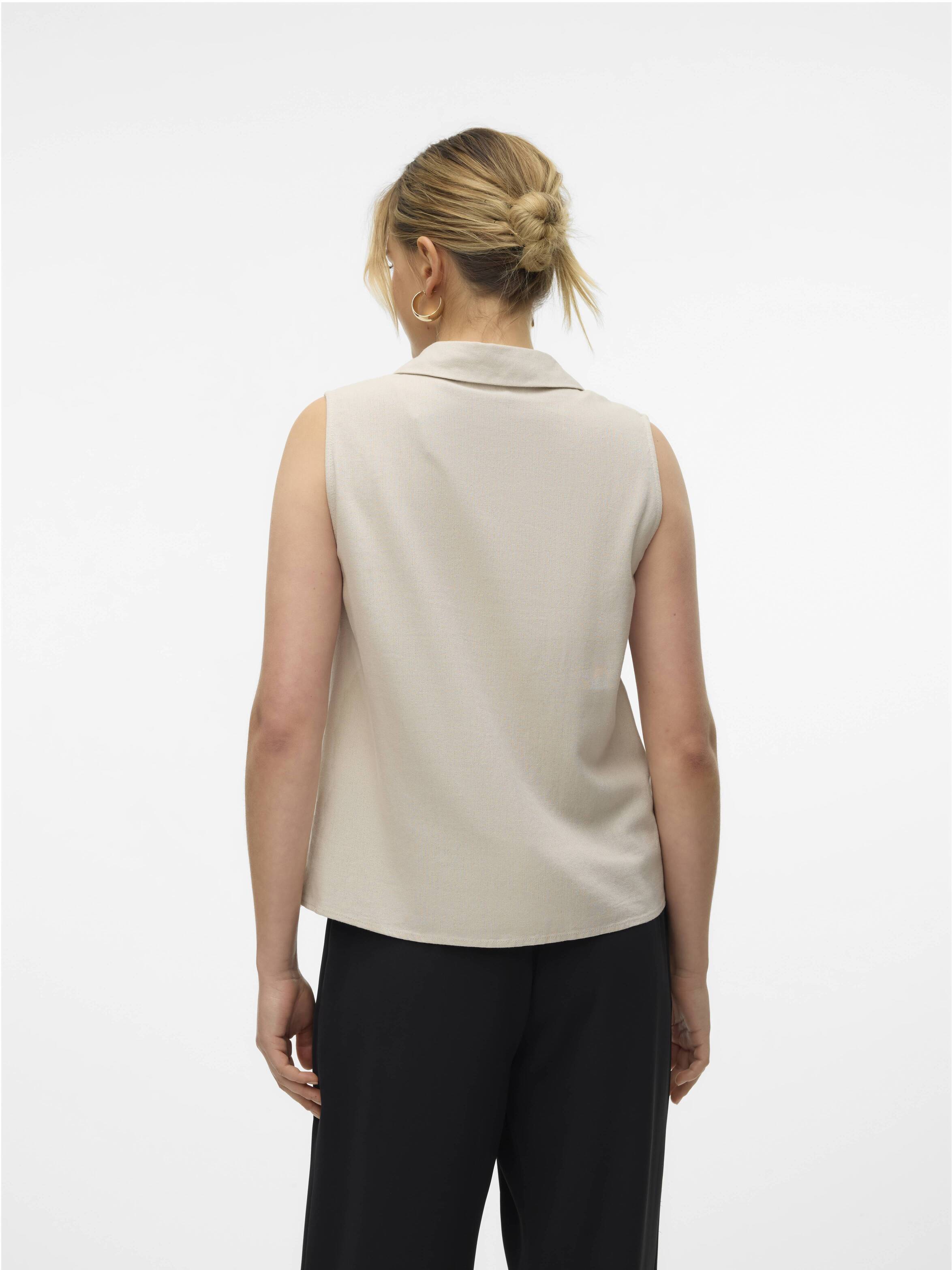 Beige Vero Moda My Nen Sleeveless V-Neck Top with collar, shown from the back, paired with black pants.