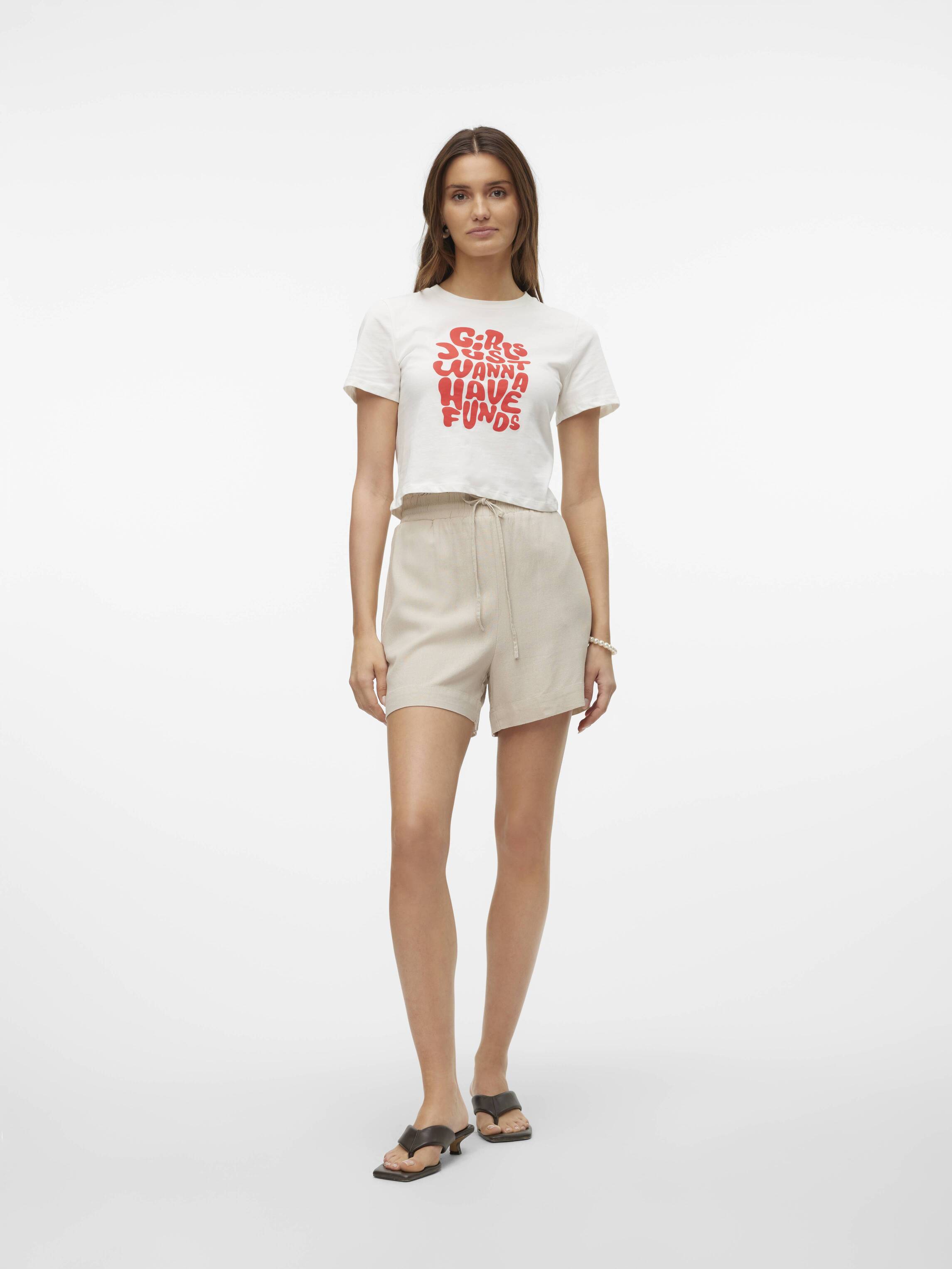 Vero Moda My Nen Poplin Pull-On Shorts in beige with drawstring waist styled with a casual white graphic top and sandals