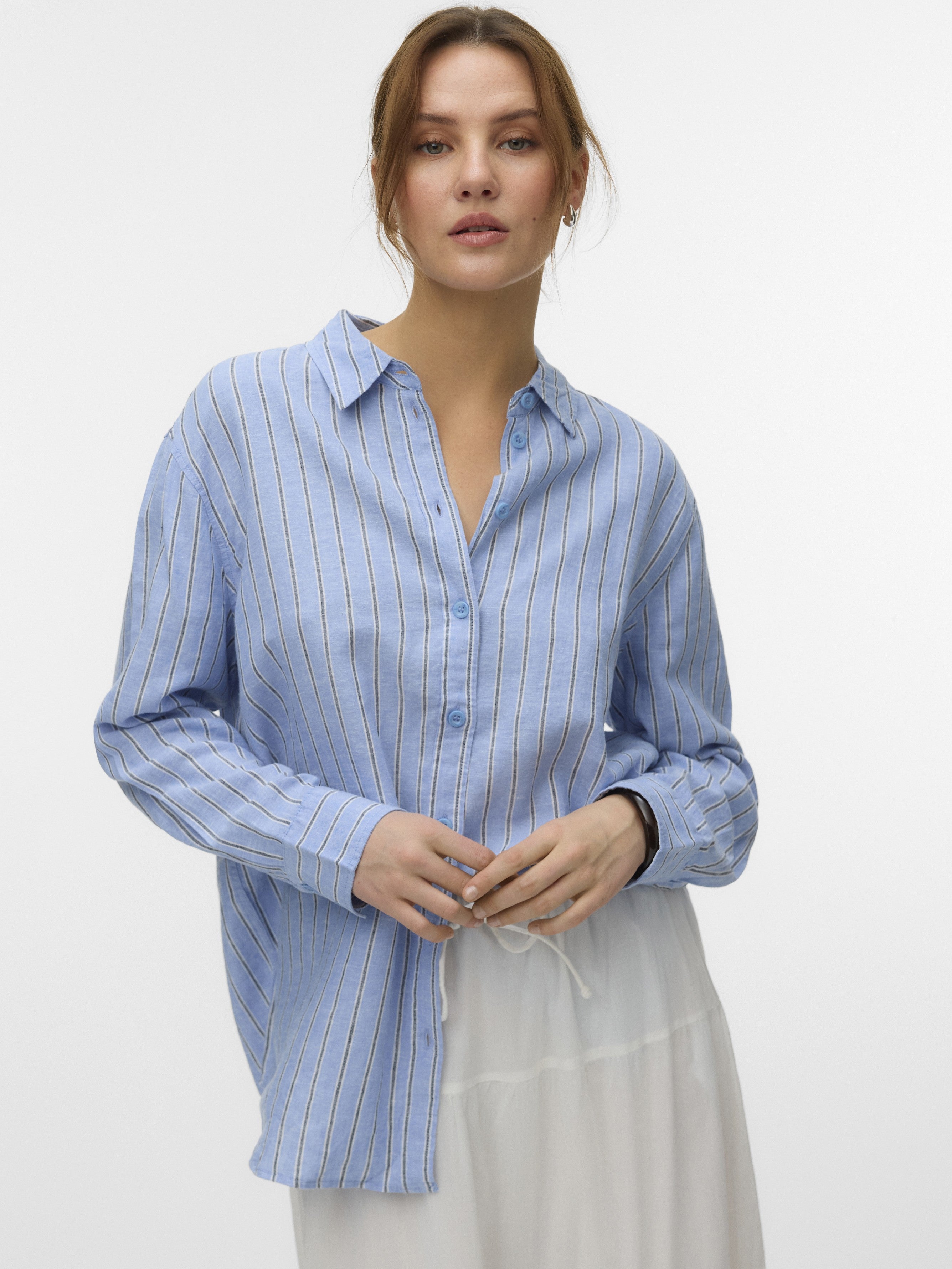 Light blue striped button-up Vero Moda Linen Striped Shirt made of linen fabric with long sleeves and collar.