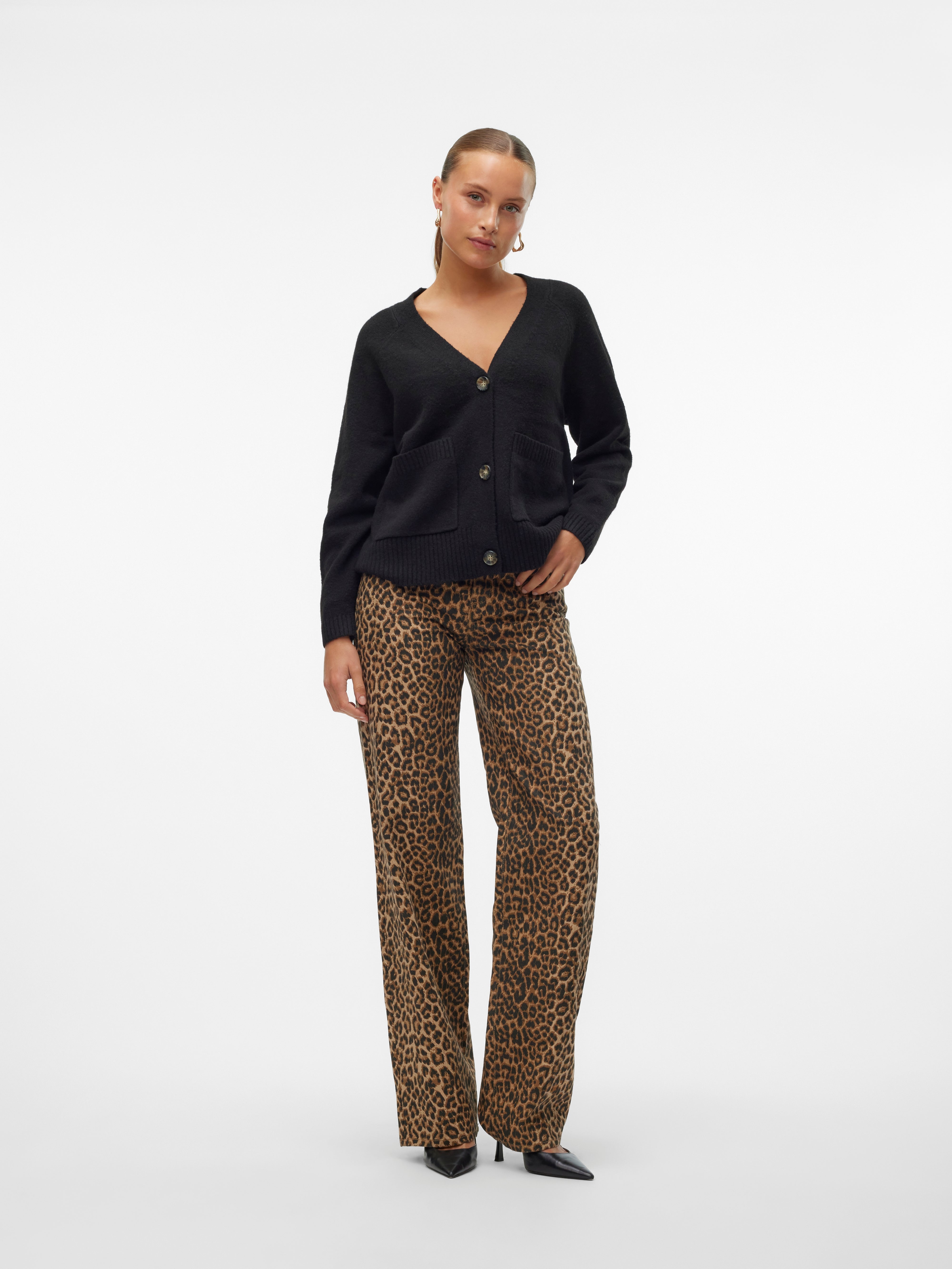 Black buttoned cardigan paired with brown leopard print wide-leg pants and black pointed heels on a white background.