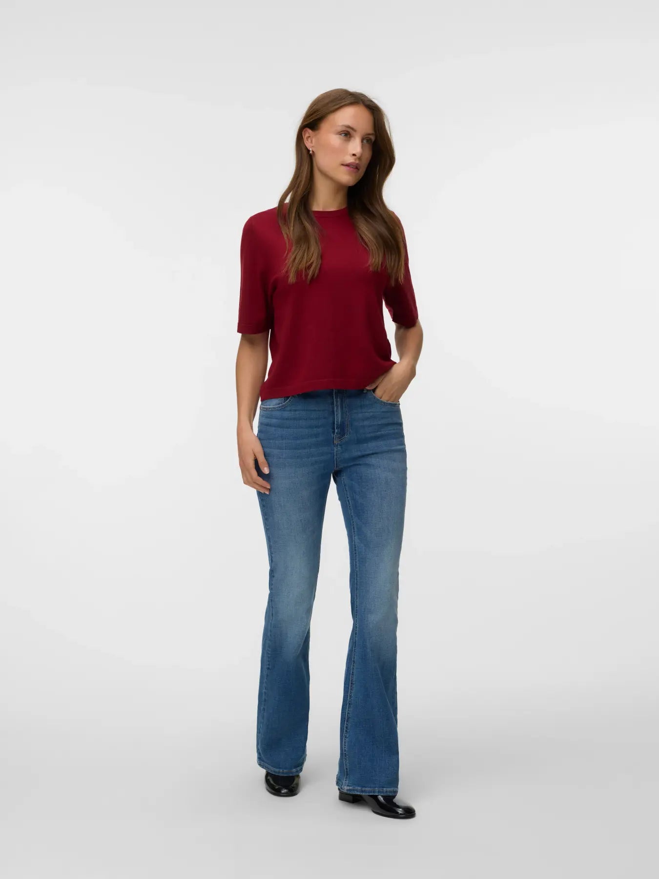 Vero Moda Silslv Crew Neck Sweater in deep red paired with blue jeans, showcasing a casual sweater from Vero Moda.