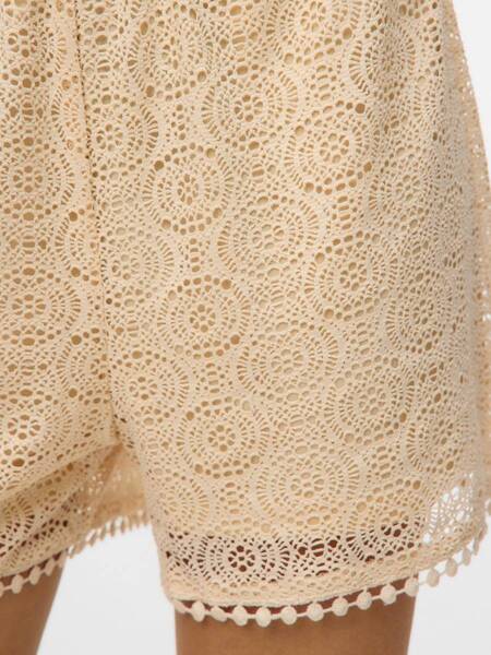 Vero Moda Mayet Pull-On Shorts in beige crochet lace fabric with intricate circular patterns and scalloped hem detail.