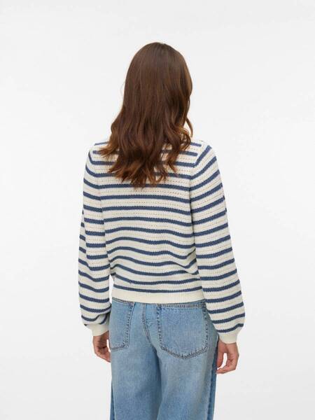 Person wearing a long sleeve striped sweater in white and navy blue with light blue denim jeans, viewed from the back.