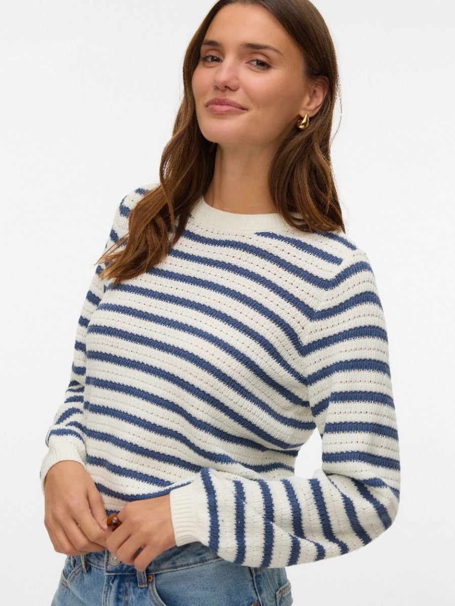 Vero Moda Gorgeous Printed Crew Neck Top in beige and navy striped knit, styled with casual denim and gold hoop earrings.