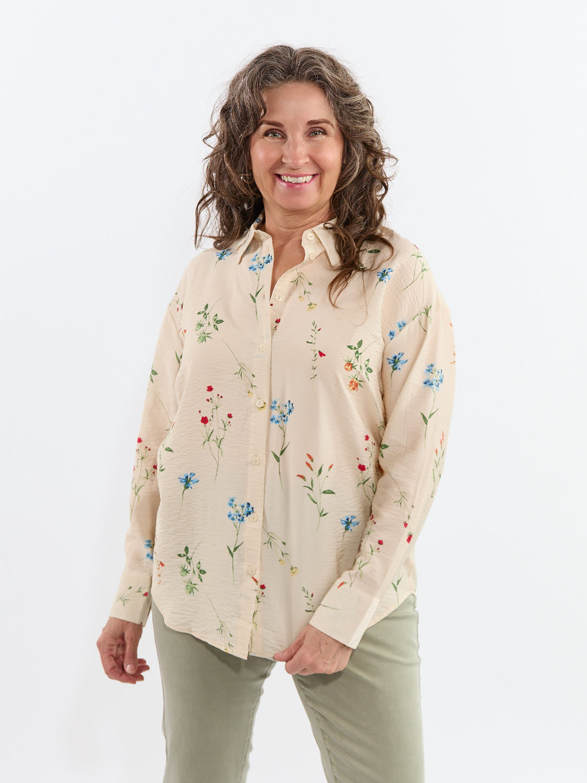 Vero Moda Josie Flowy Short Sleeve Blouse in beige with a floral print, styled with casual pants