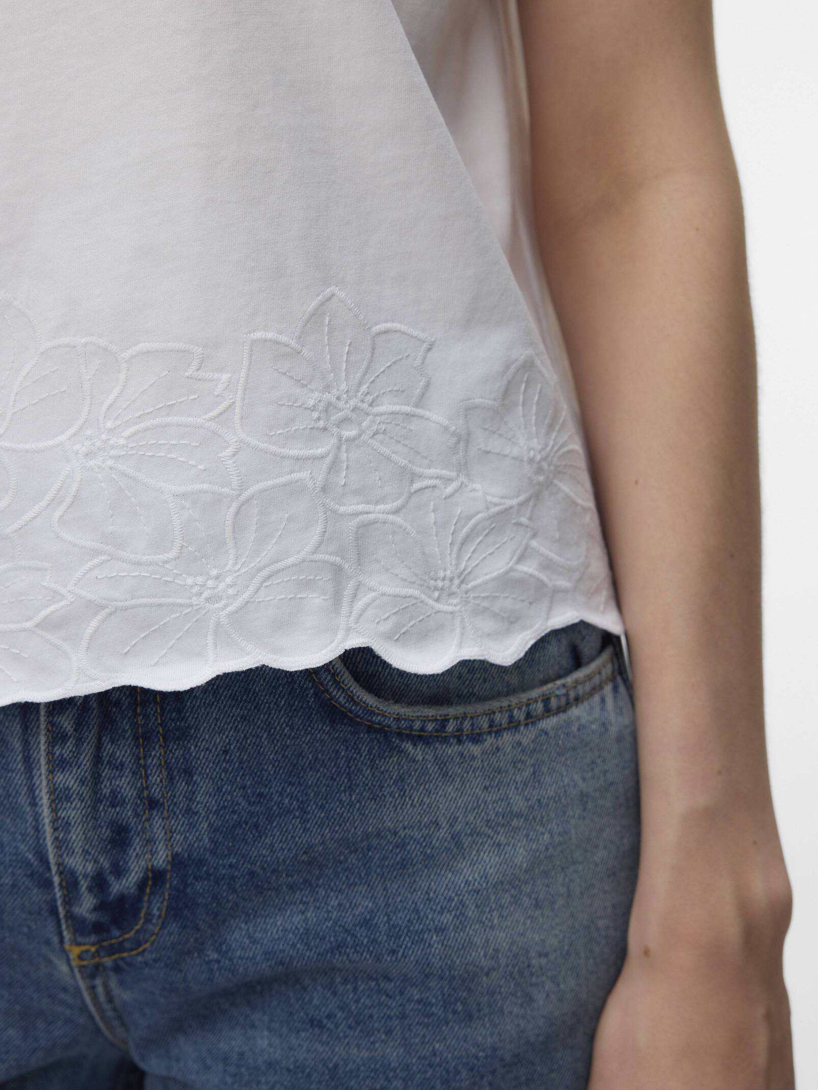 Vero Moda Noah Embroidered Short Sleeve Top in white with floral embroidery paired with blue denim jeans from Vero Moda.