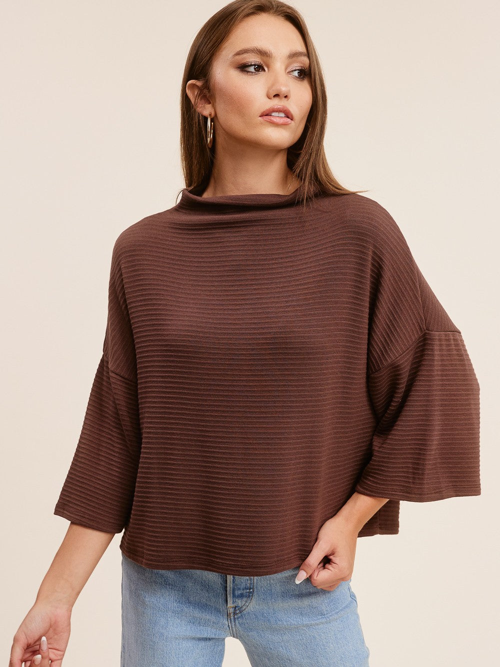 Oh My Otto Boxy Rib Knit Top in brown ribbed fabric by Jolie Inc., styled with light blue denim jeans.