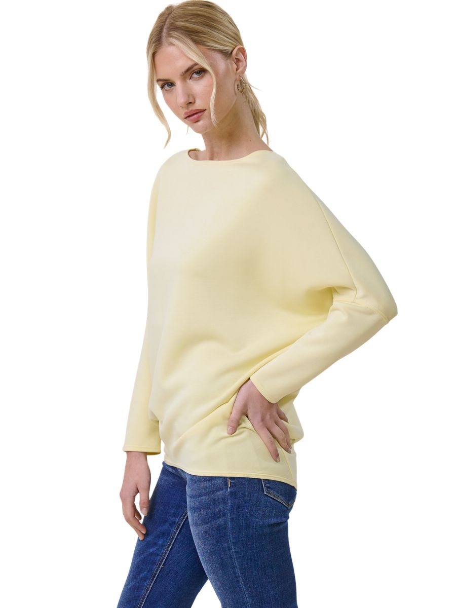 Light yellow Julie Modal Dolman Top by Jolie Inc. styled with blue denim jeans, soft fabric and relaxed fit design.