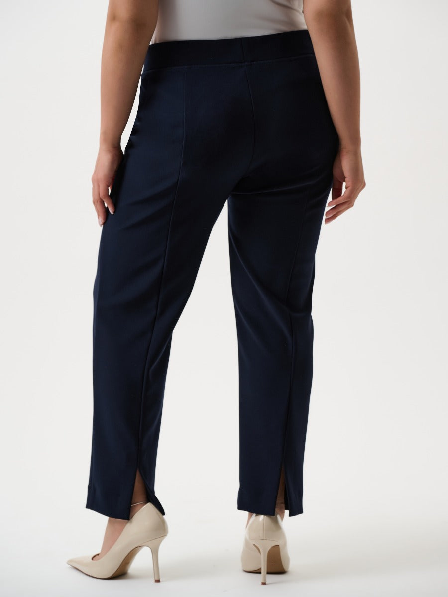 Joseph Ribkoff 29" Silky Knit Pant in navy blue by Joseph Ribkoff, showcasing back slit detail and elegant fit.