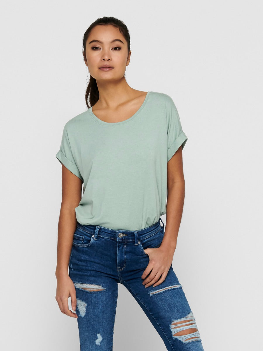 ONLY Moster Short Sleeve Crew Tee by Only in soft green, styled with distressed blue denim jeans, casual top fashion