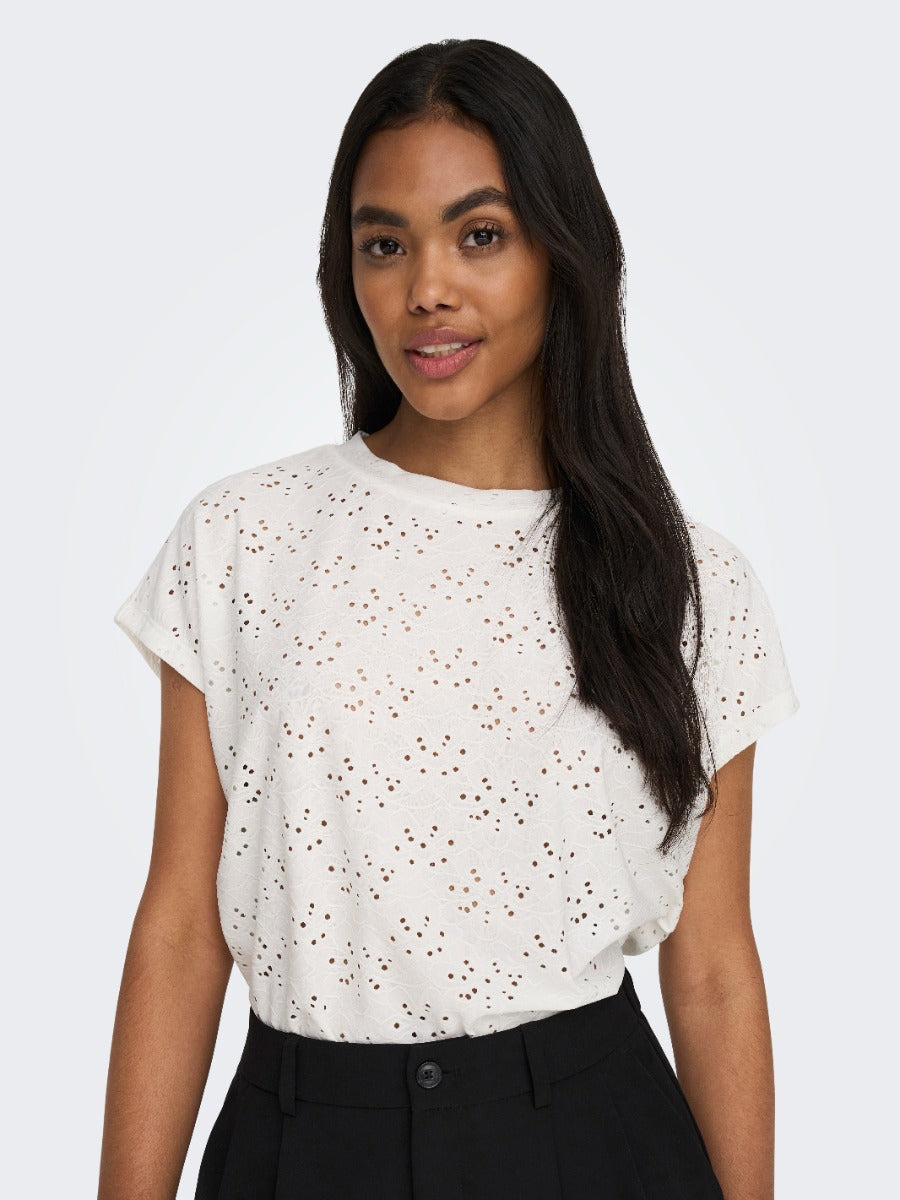 ONLY Smilla Eyelet Top by Only in off-white with delicate eyelet detailing paired with black pants