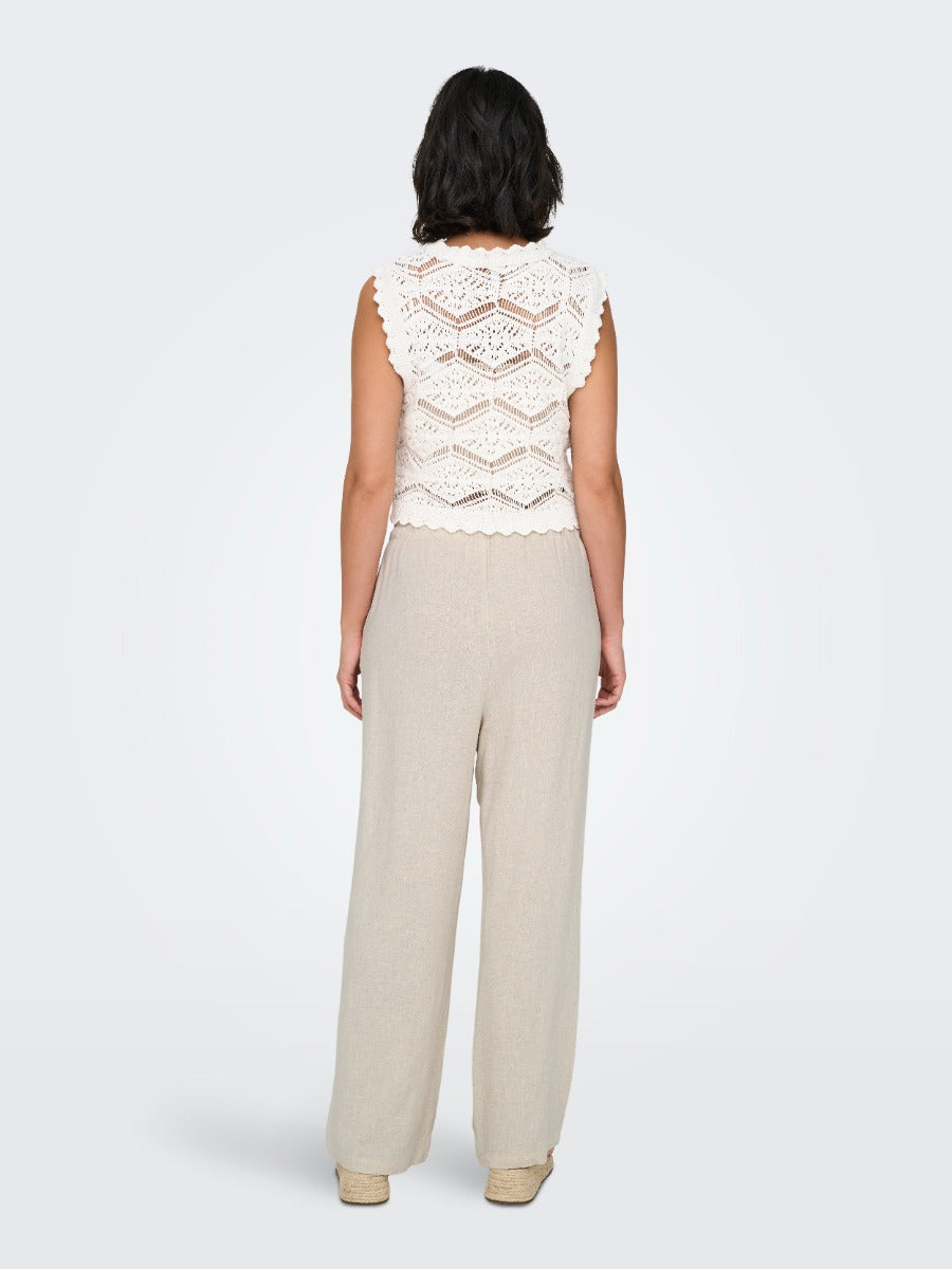 Back view of ONLY Siesta Linen Blend 32" Pant in beige by Only with a textured white sleeveless top.