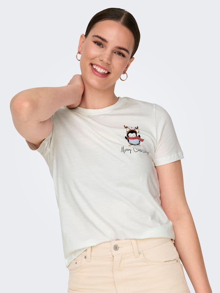 Smiling model in a white graphic T-shirt and light beige jeans against a pale background