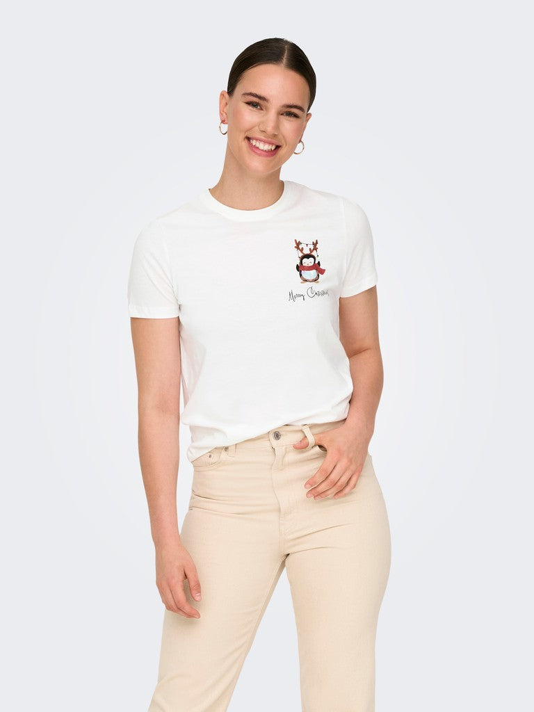 White graphic T-shirt paired with beige trousers against a light gray background