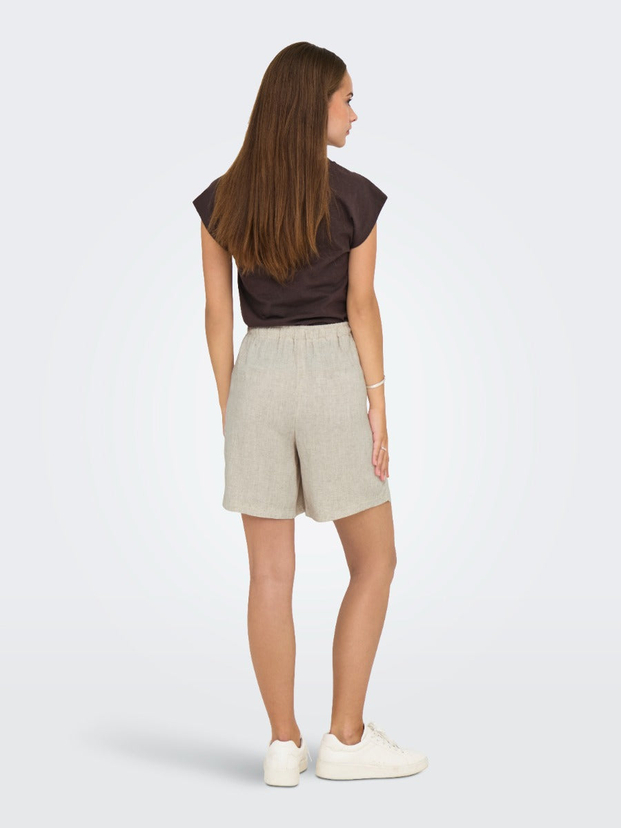 Back view of ONLY Siesta Linen Blend Short in light neutral tone by Only paired with casual dark top and white sneakers