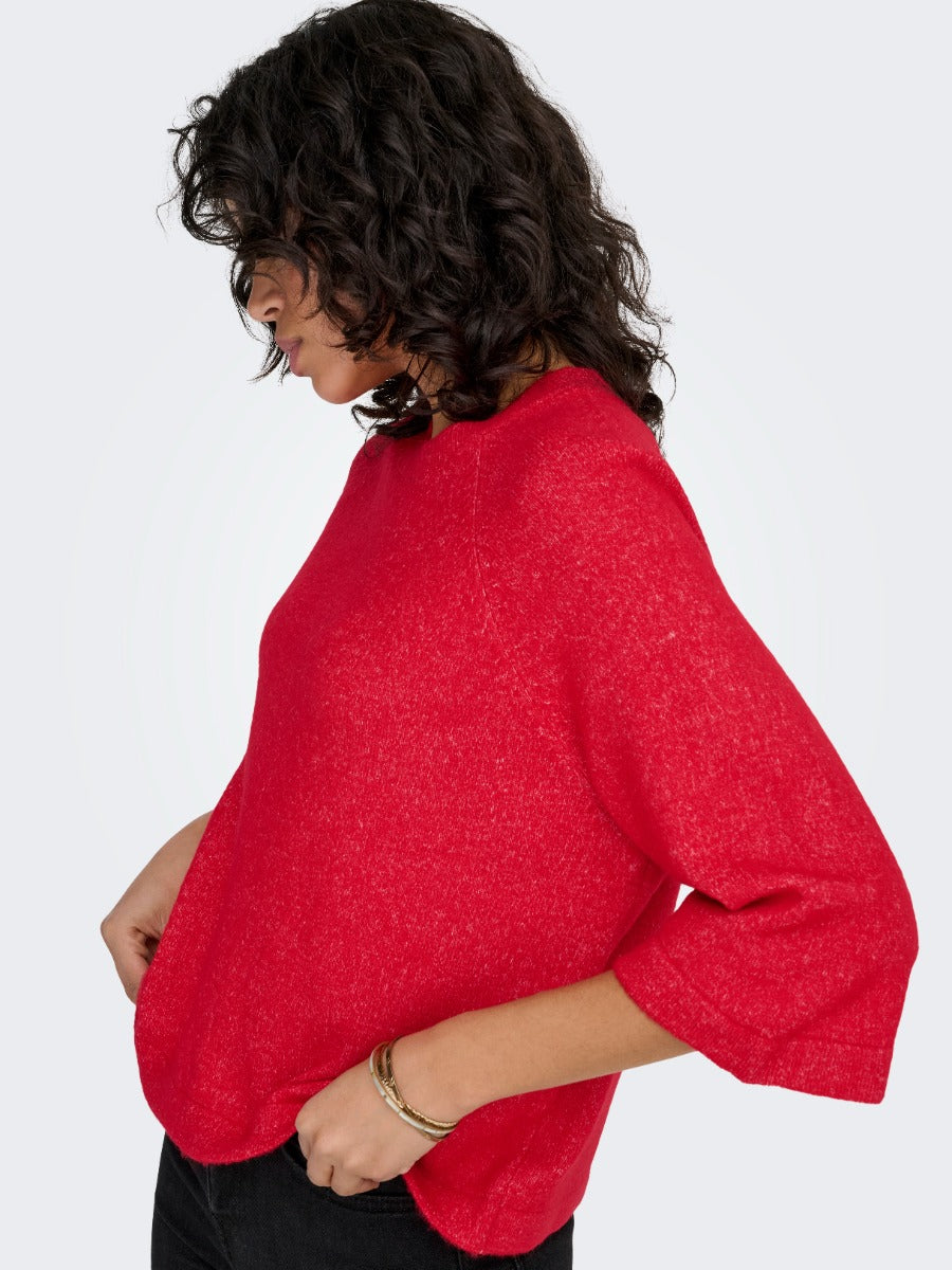 Red knitted ONLY Simoni 3/4 Sleeve Sweater styled with black pants and gold bracelet by Only brand