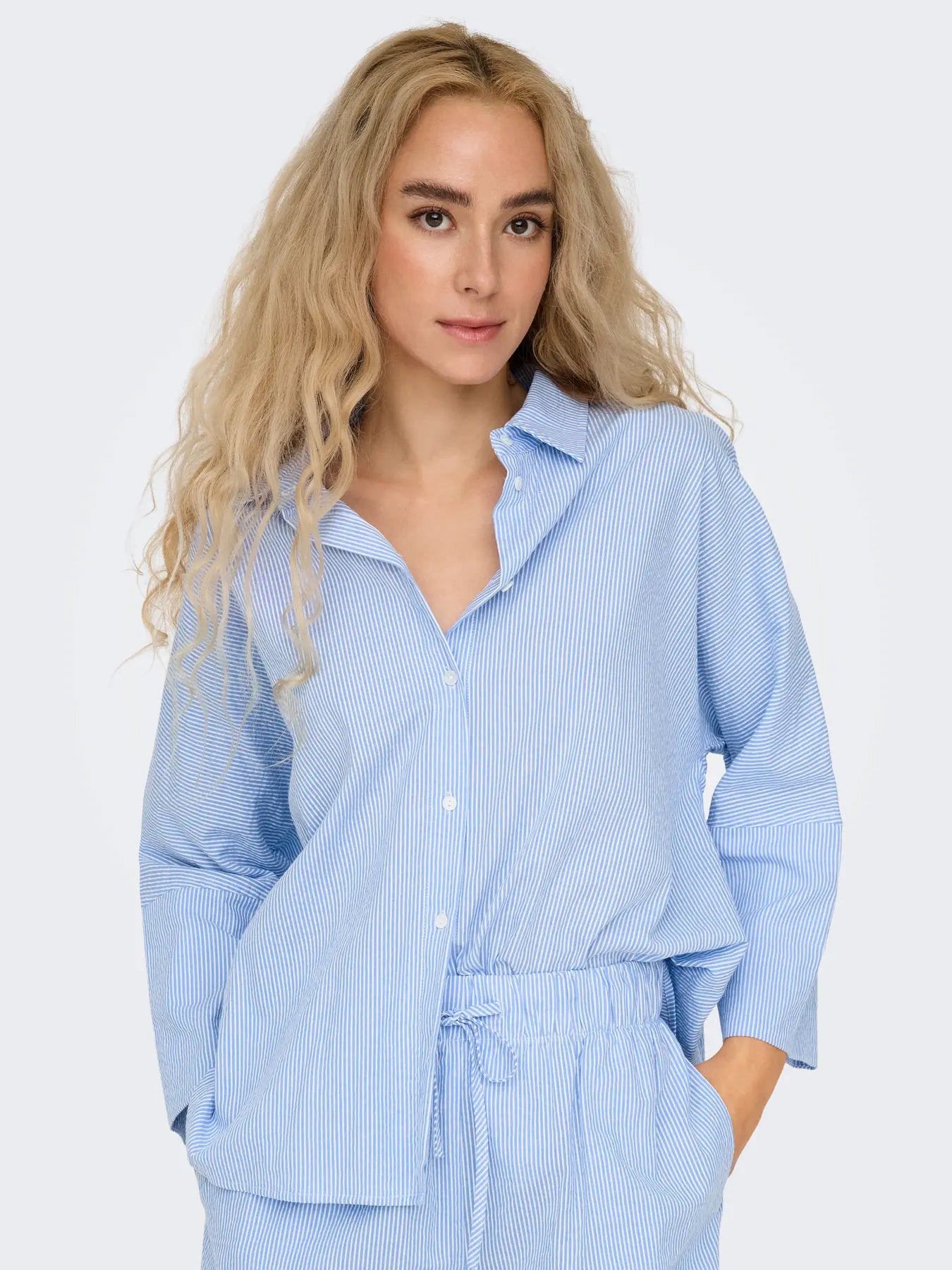Only Augusta Stripe Cotton Button-Up Shirt by Only in light blue striped cotton fabric with button closure and relaxed fit