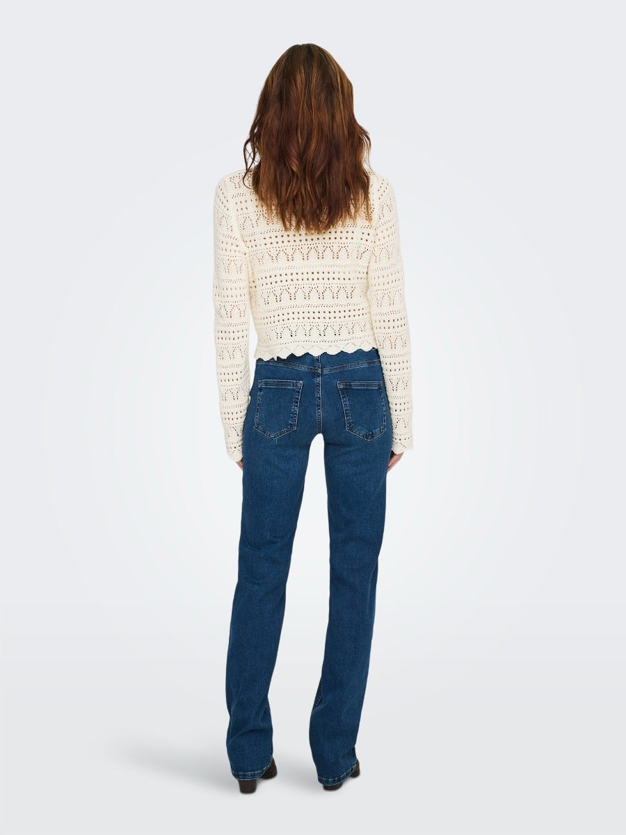 Only Leike Crochet Sleeveless Top by Only shown from back in cream crochet pattern paired with blue denim jeans.