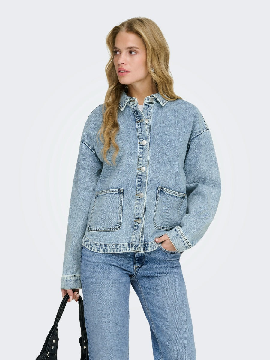 ONLY Ferbie Women’s Double Pocket Denim Jacket by Only in light blue with two front pockets and button closure.