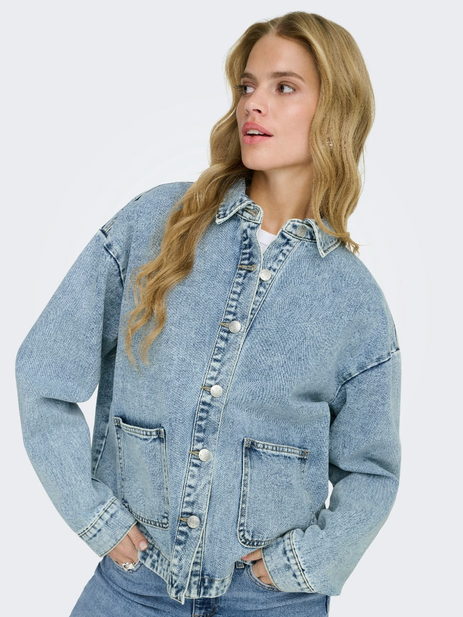 ONLY Ferbie Women’s Double Pocket Denim Jacket by Only in light blue denim with front button closure and two patch pockets.