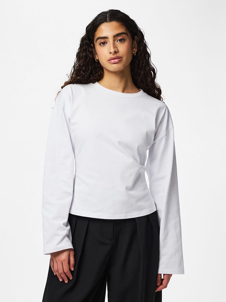 Amy Back Zip Long Sleeve Top by Pieces in white cotton, styled with black trousers, simple and versatile top