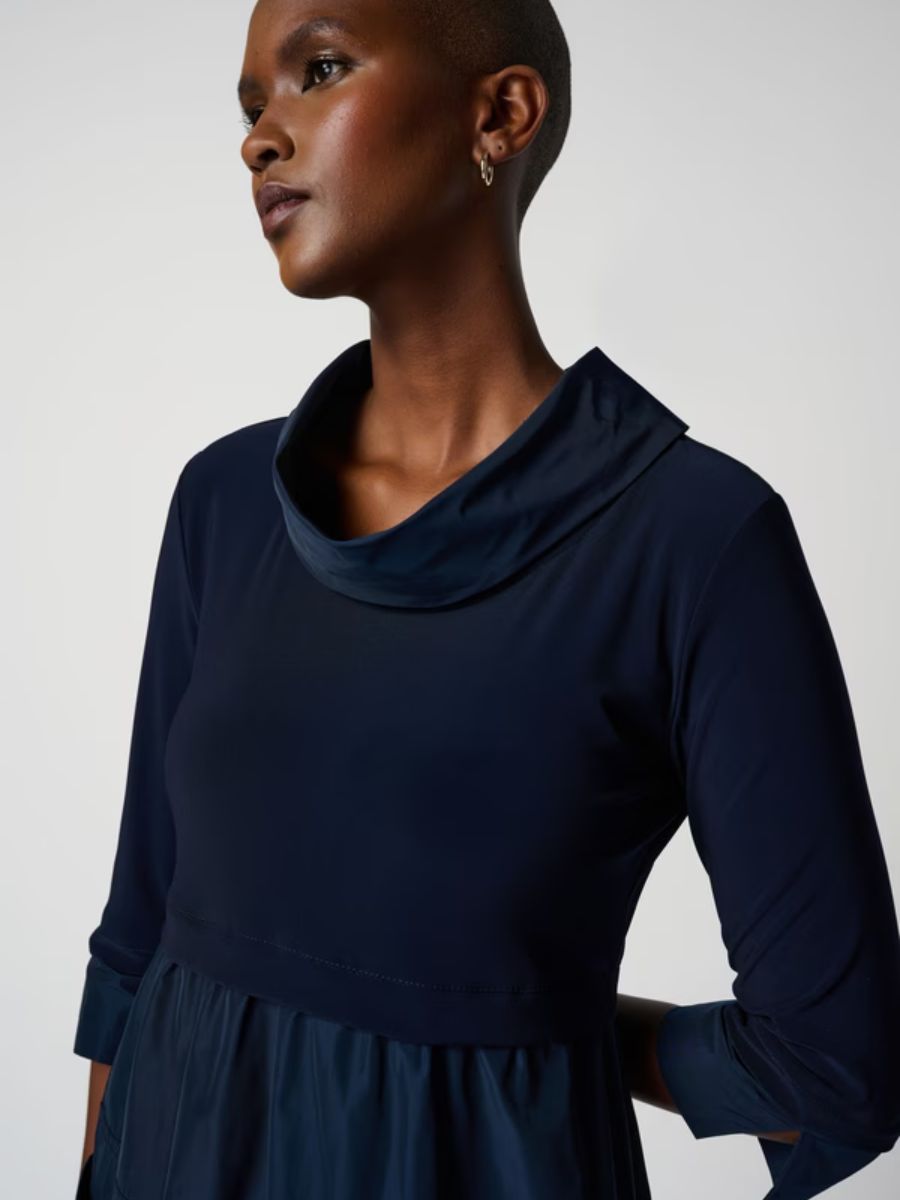 Close-up of a deep navy Joseph Ribkoff Miracle Nylon Dress featuring a unique collar and long sleeves.