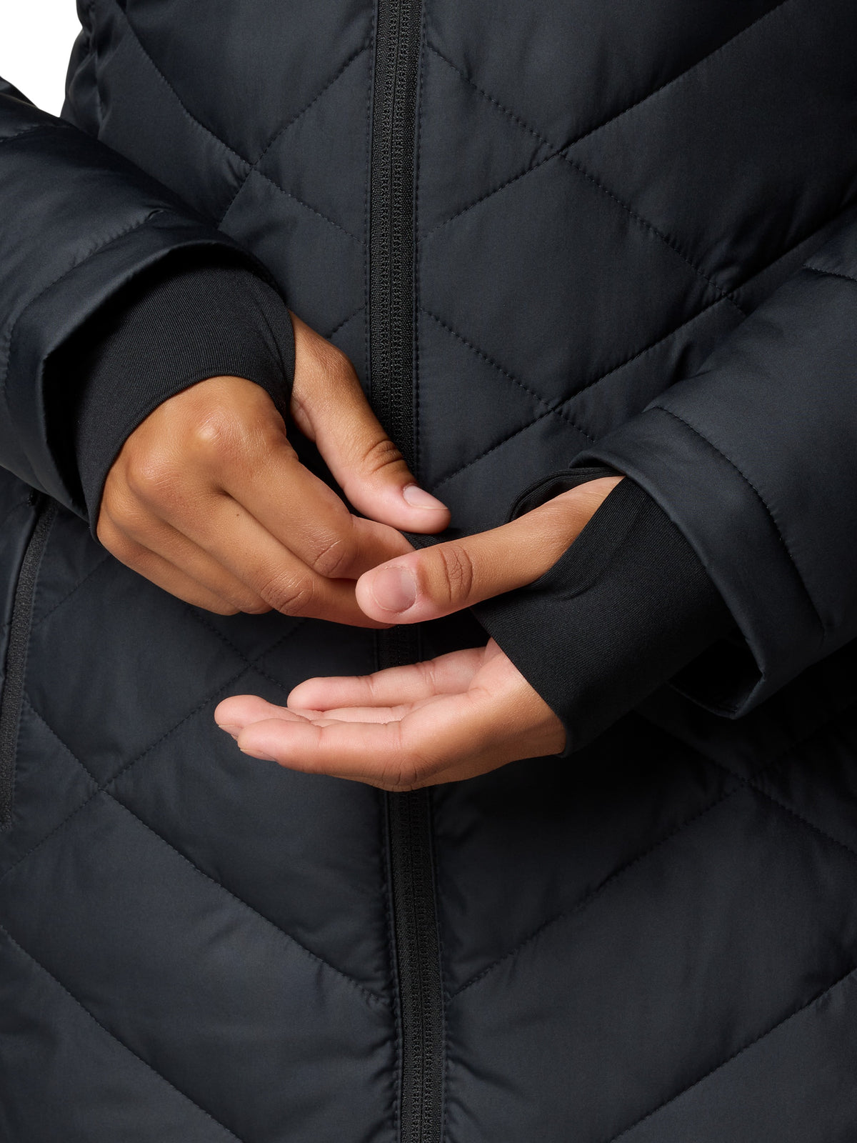 Close-up of black quilted Columbia Heavenly 3/4 Length Hooded Omni-Heat Jacket with thumb hole cuffs on sleeves