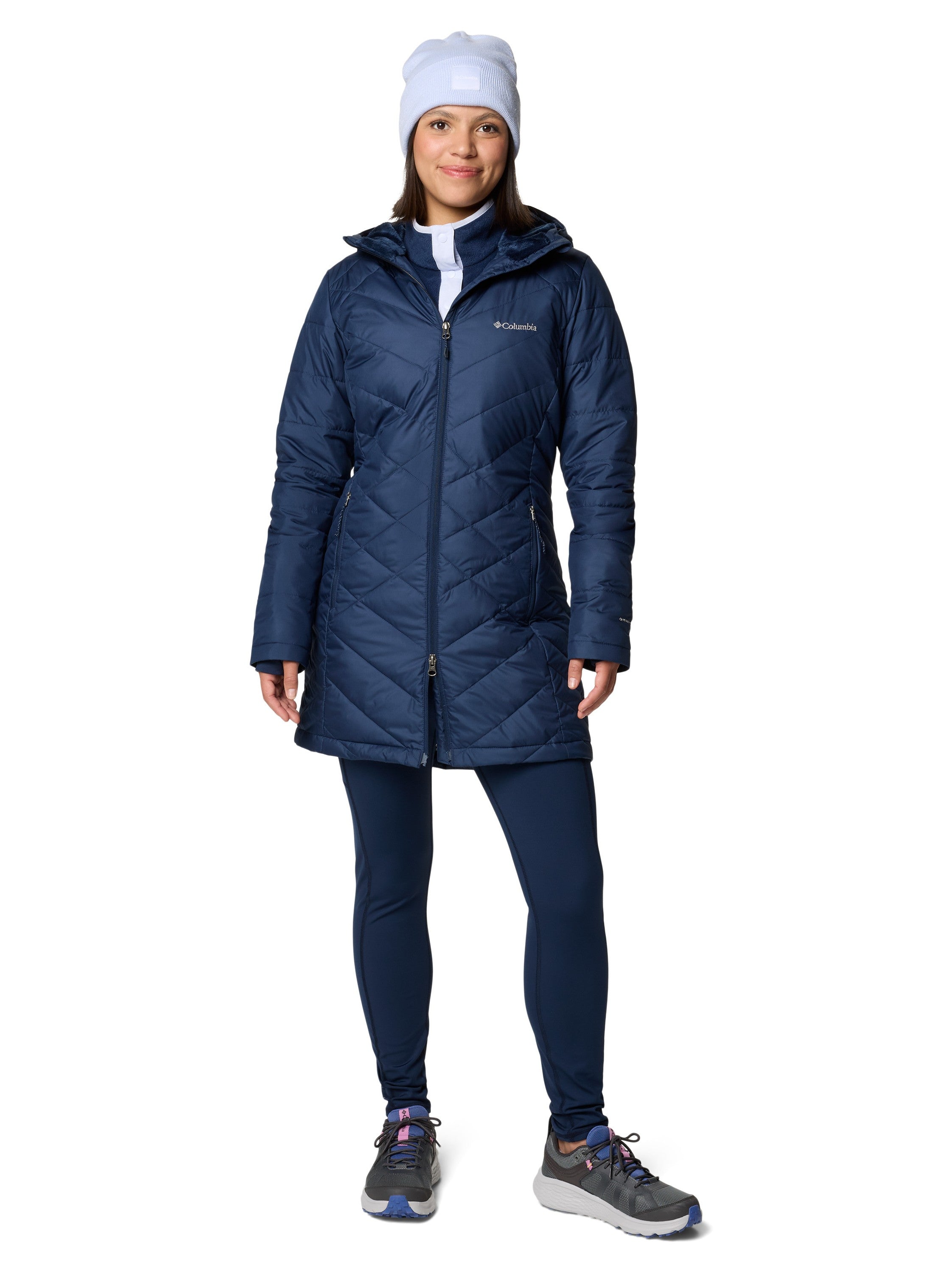 Columbia Heavenly 3/4 Length Hooded Omni-Heat Jacket in navy blue, styled with leggings and a knit hat outdoors