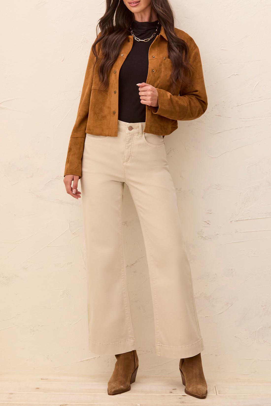 Tribal It’s The One 30" Five-Pocket Colored Denim Jeans in beige styled with a brown jacket by Tribal Sportswear Inc.
