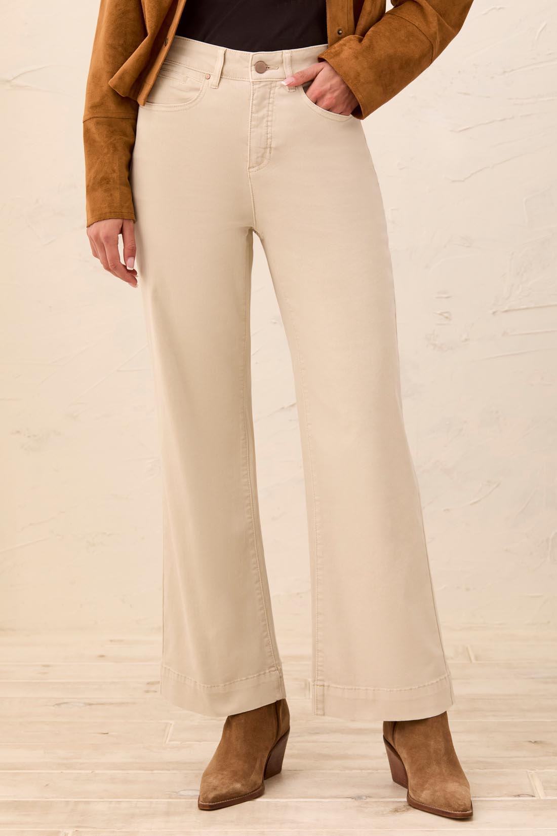 Tribal It’s The One 30" Five-Pocket Colored Denim Jeans in beige styled with brown jacket and boots by Tribal Sportswear Inc.