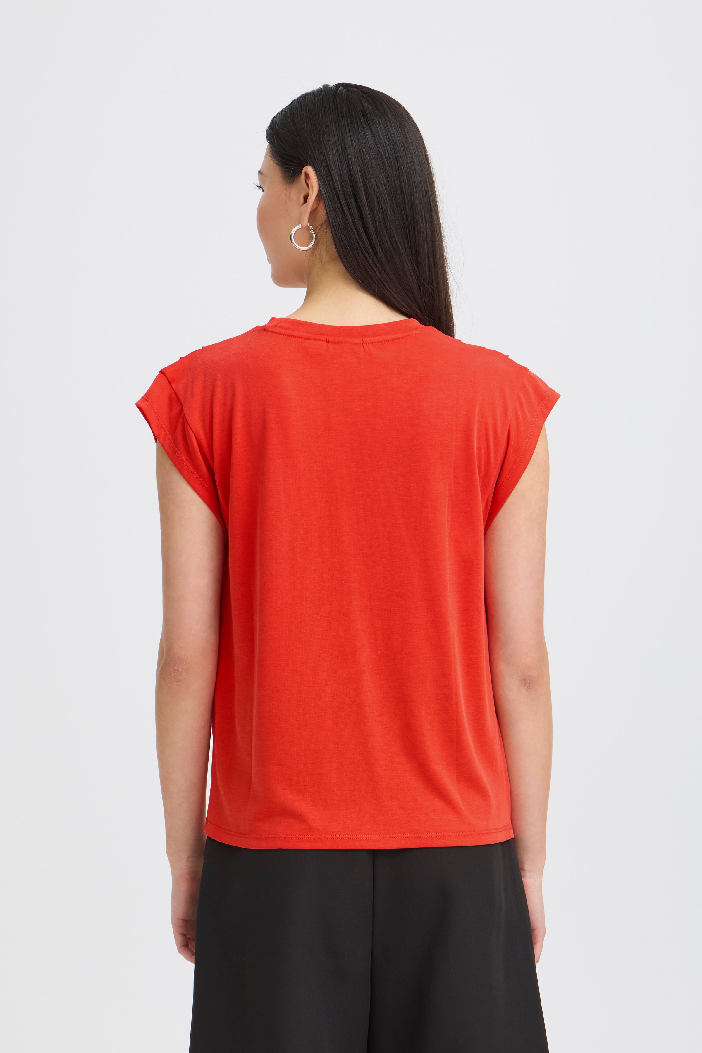Back view of a red Ichi Lisken Top with cap sleeves, paired with black bottoms, by Ichi.