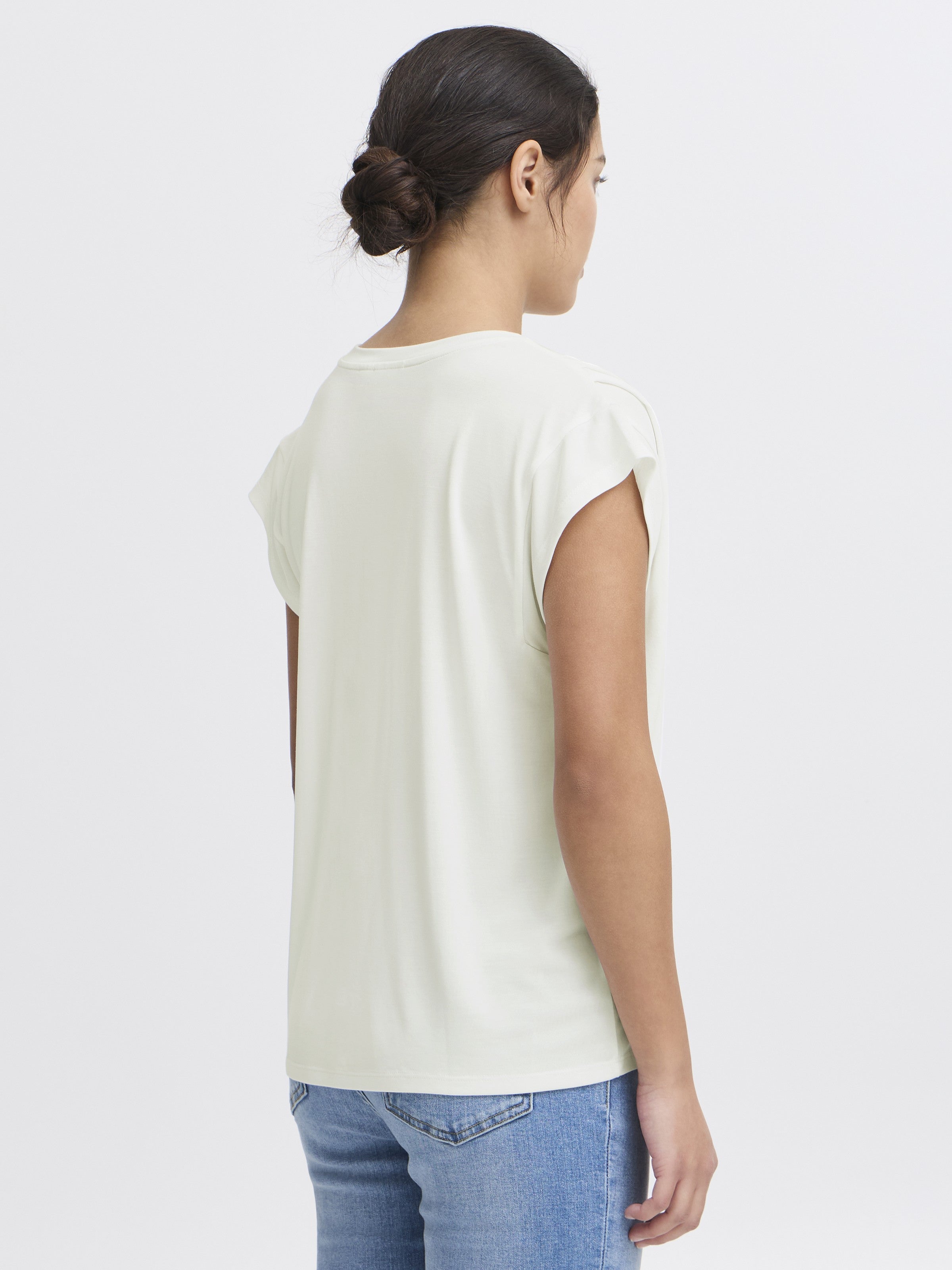 Back view of Ichi Lisken Top in white, styled with casual blue denim jeans by Ichi.