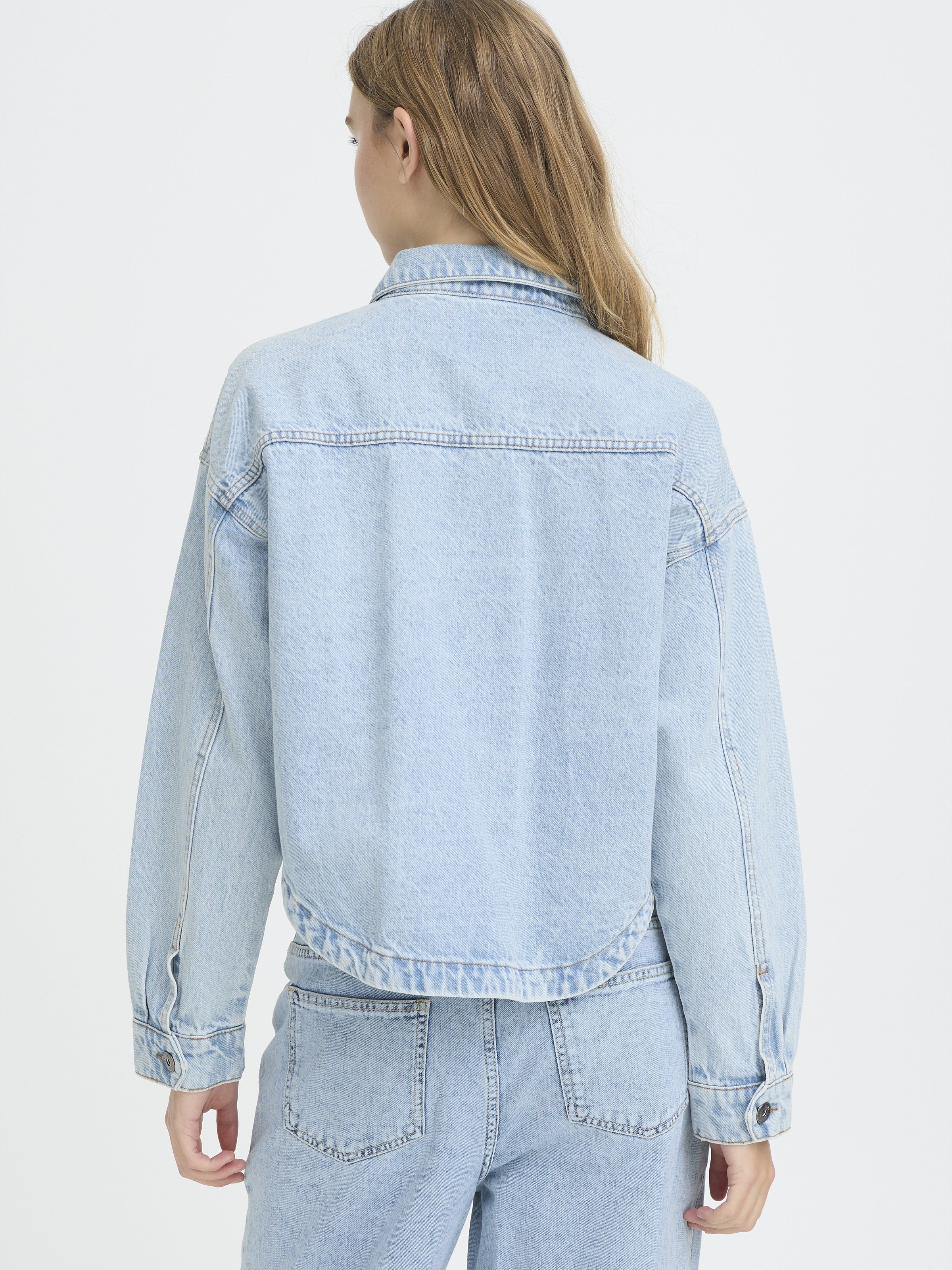 Light blue denim outerwear shown from the back featuring the Ichi Bauve Flower Denim Jacket by Ichi.