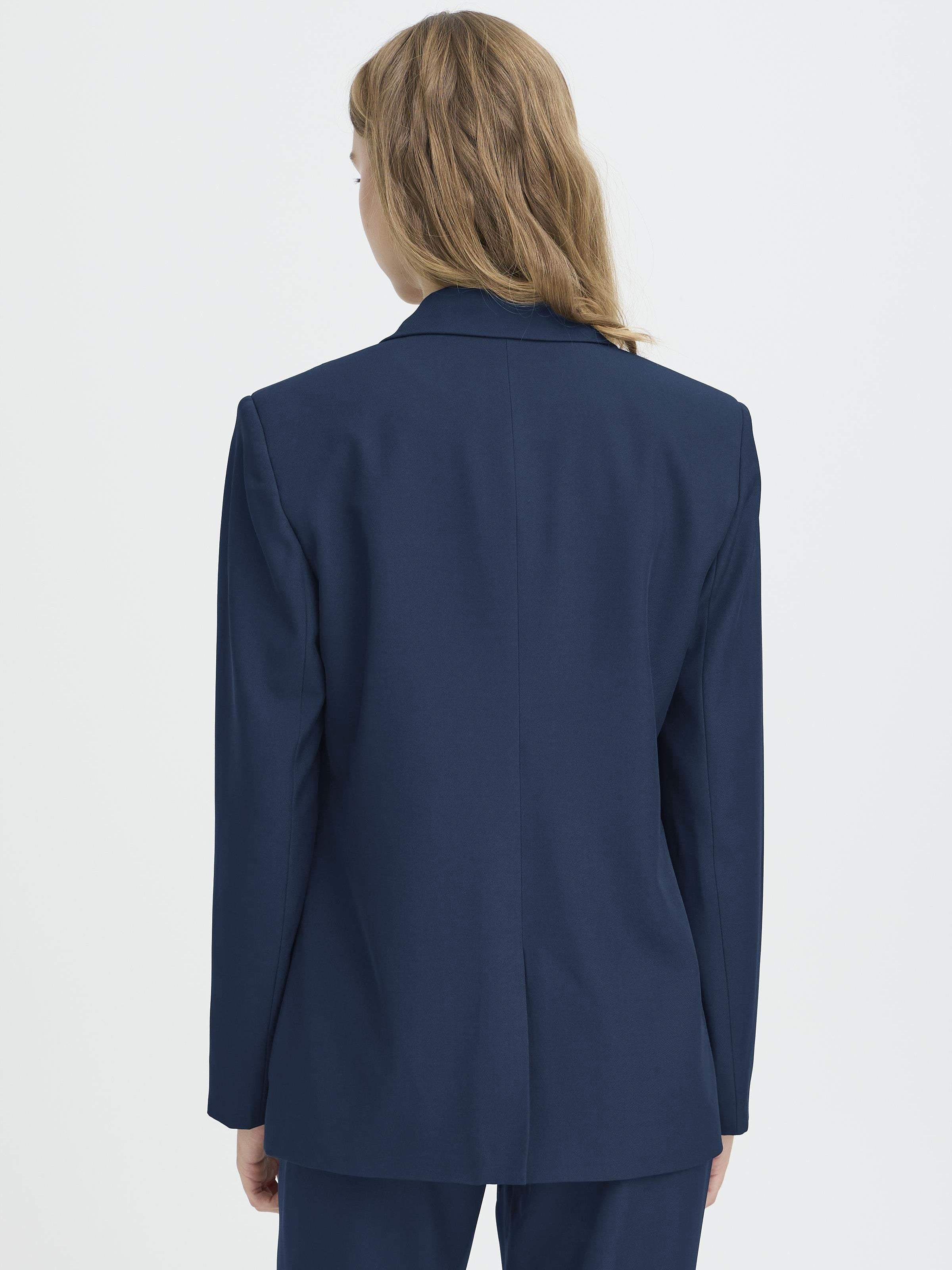 Back view of a navy blue tailored jacket with long sleeves and a center back seam detail