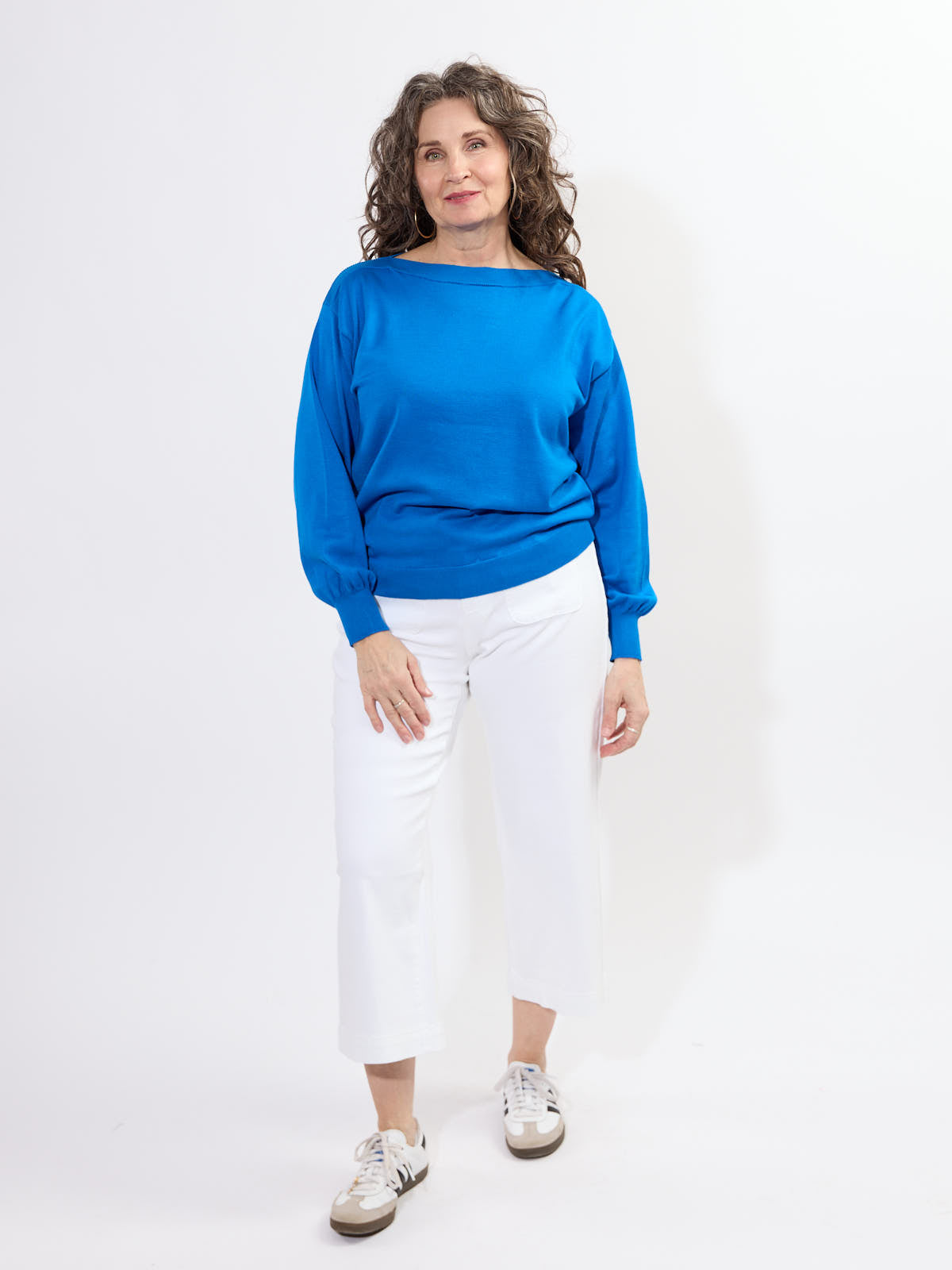 Ichi Boat Neck Sweater in vibrant blue paired with white pants, styled in a casual modern outfit by Ichi.