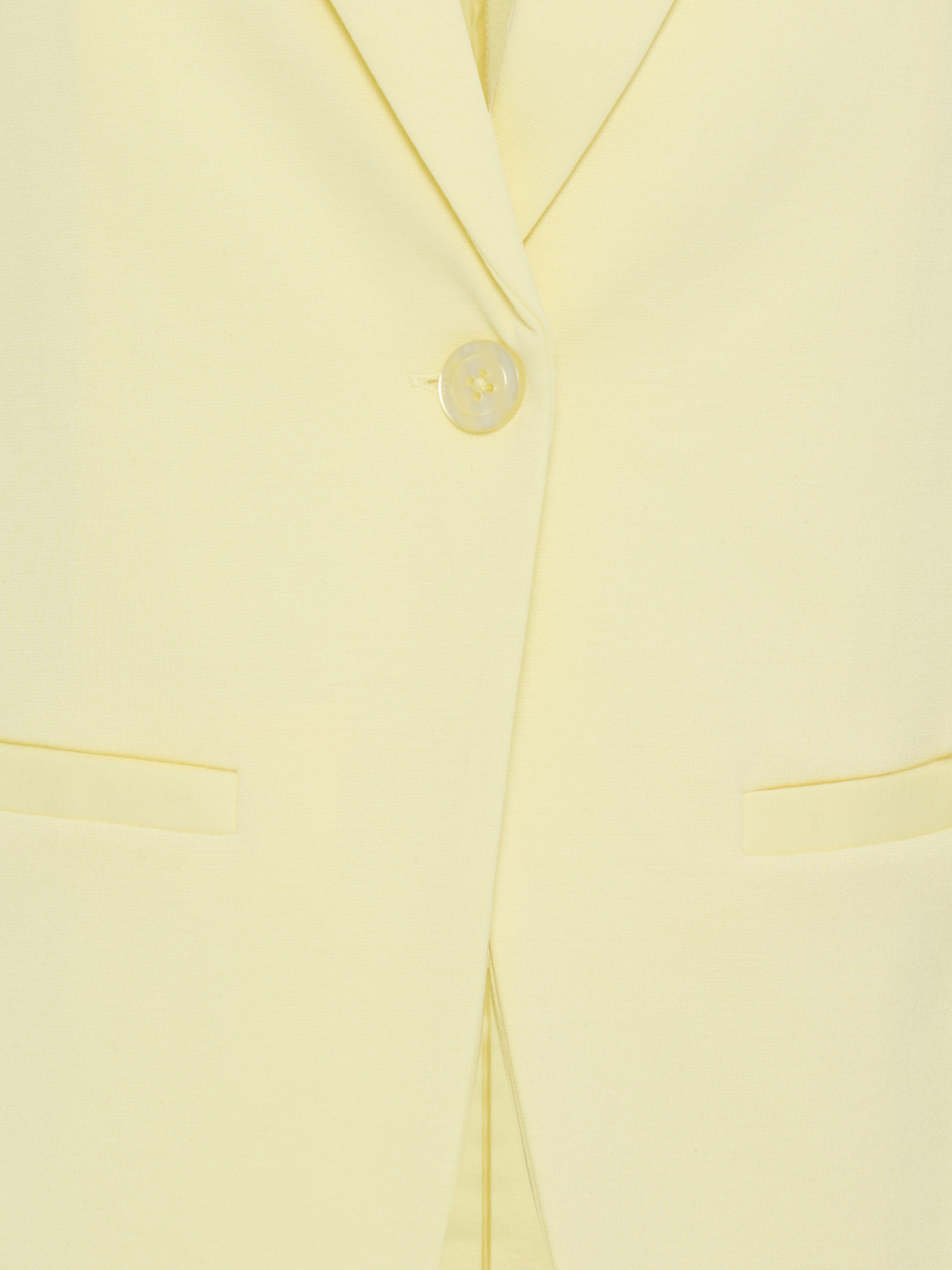 Close-up of the button and pockets on the yellow Fransa Gathered Sleeve Stretch Blazer outerwear garment.