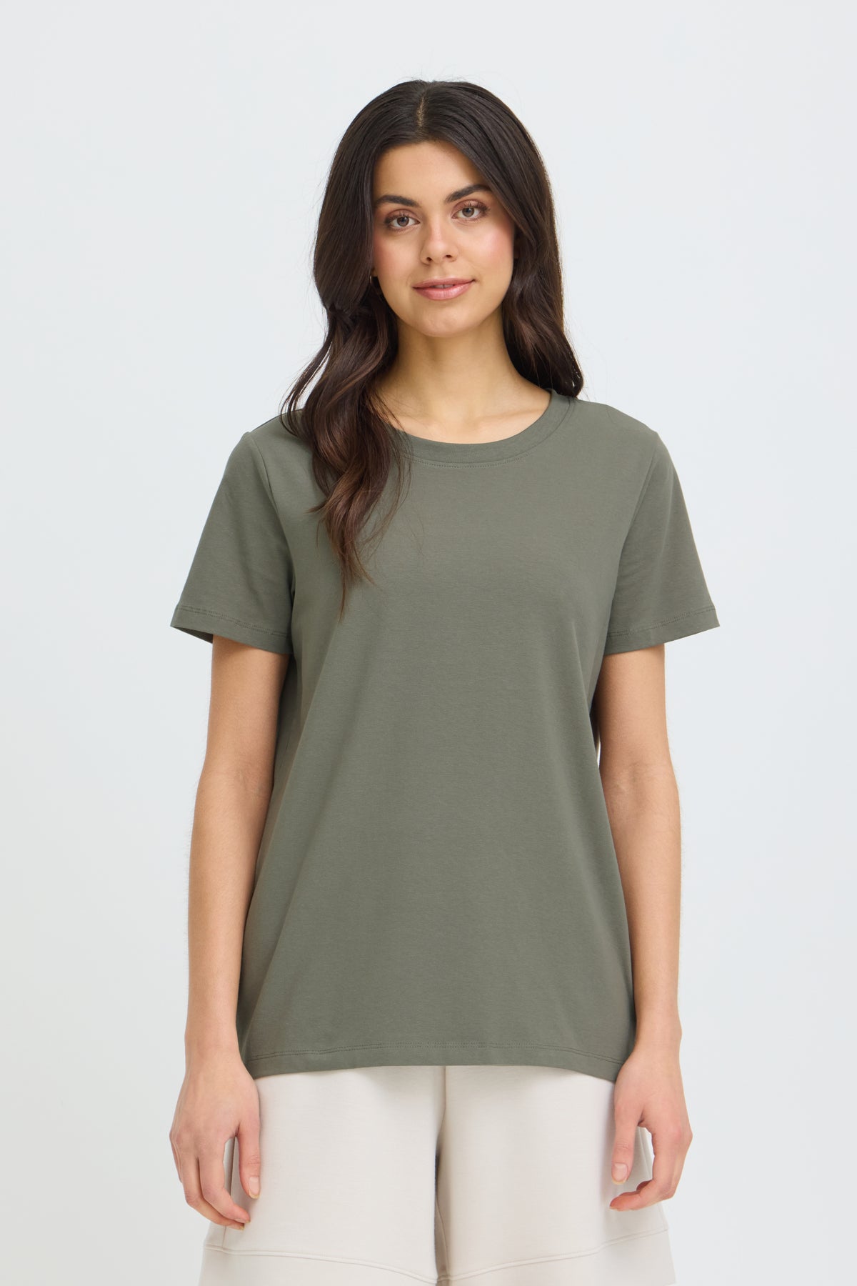 Olive green cotton Fransa Shoulder Detail Short Sleeve Crew Neck T-Shirt styled with beige shorts on a light background