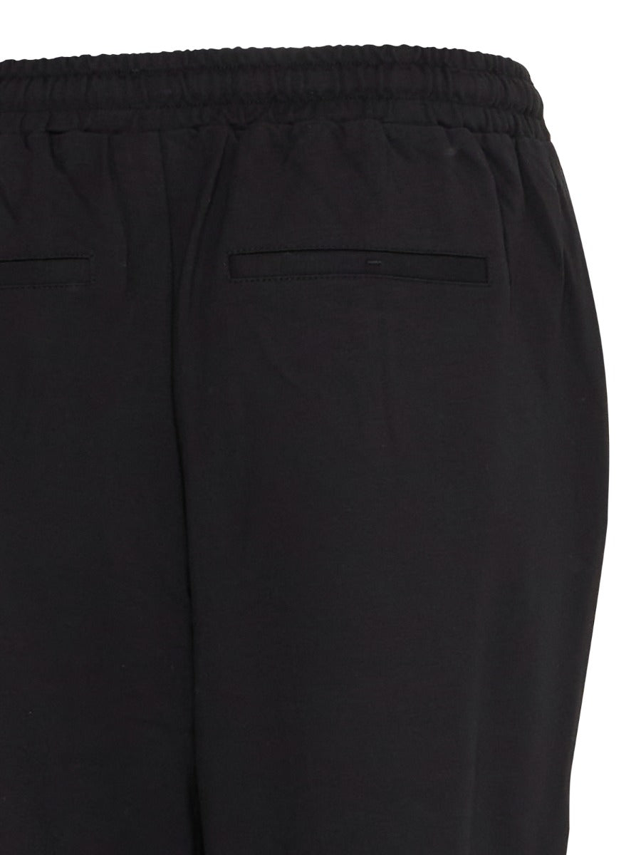 Close-up of black Fransa Jenns Stretch Tailored Pants featuring elastic waistband and back welt pockets by Fransa.